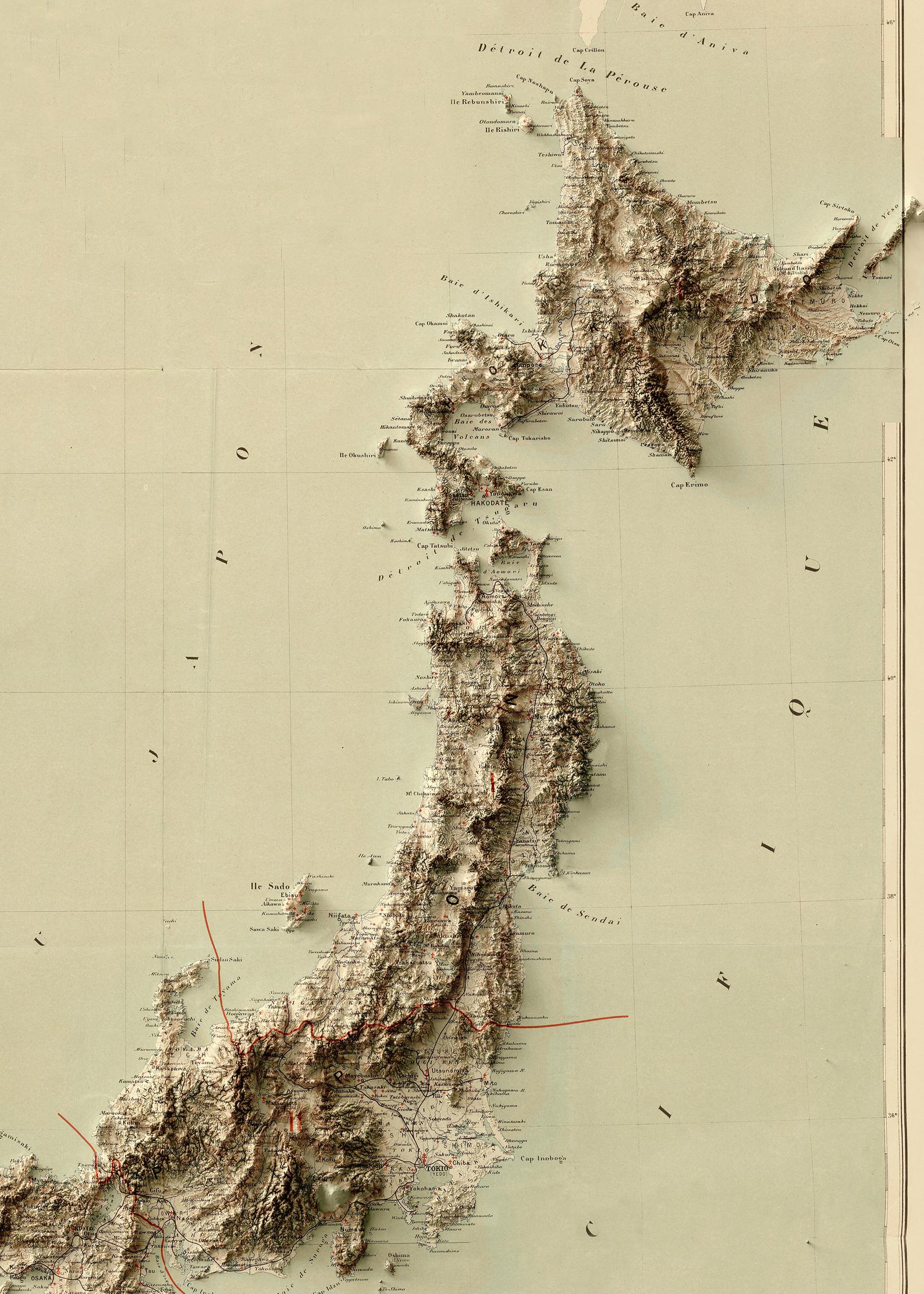 Detailed close-up of a vintage Japan relief map, showcasing textured topography and geographic contours