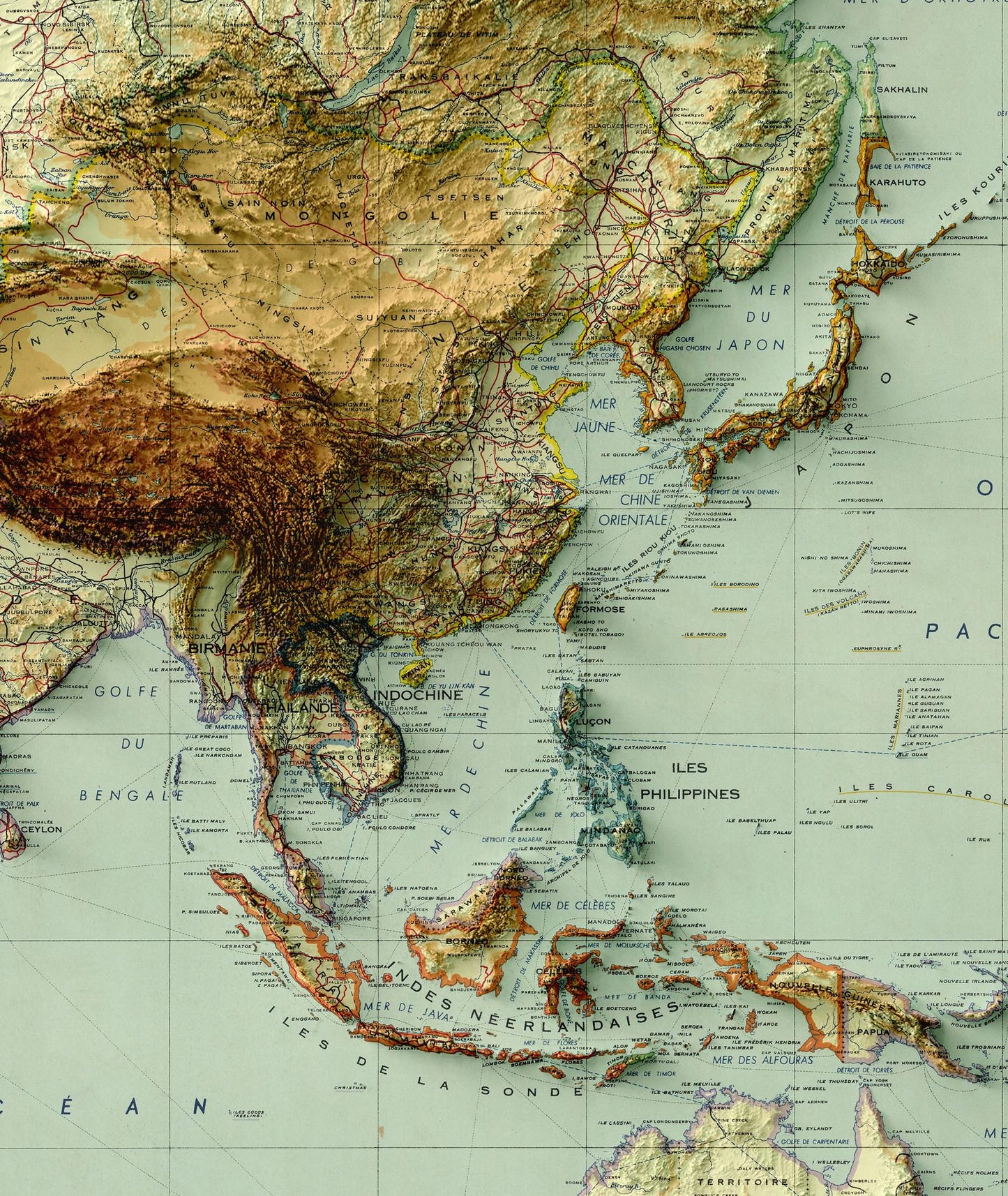 Detailed close-up of a vintage Asia and Australia relief map, showcasing textured topography and geographic contours