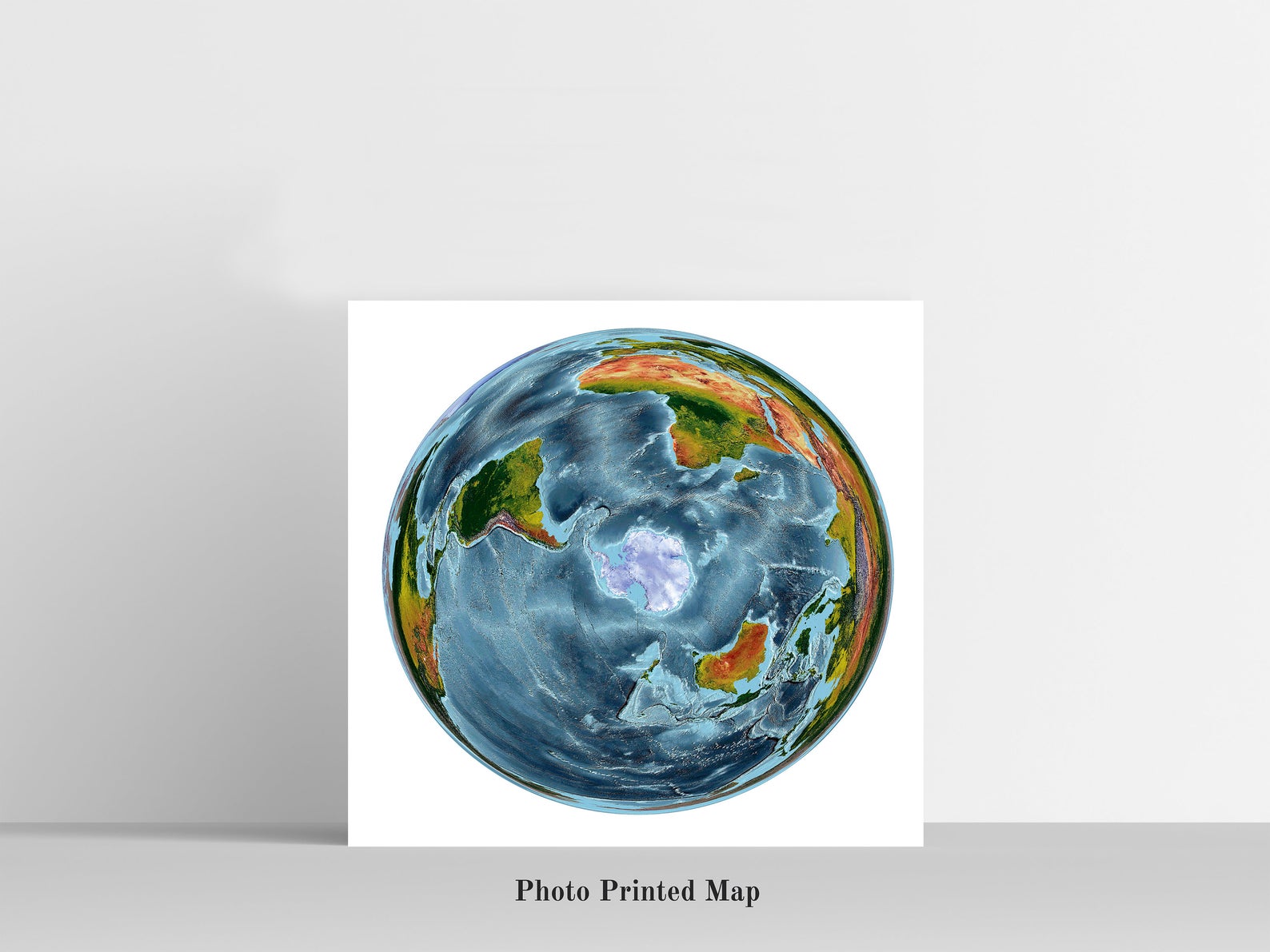 WGS 1984 Grid South Projection World Shaded relief map print, highlighting topography. Ideal for home decor and geography lovers