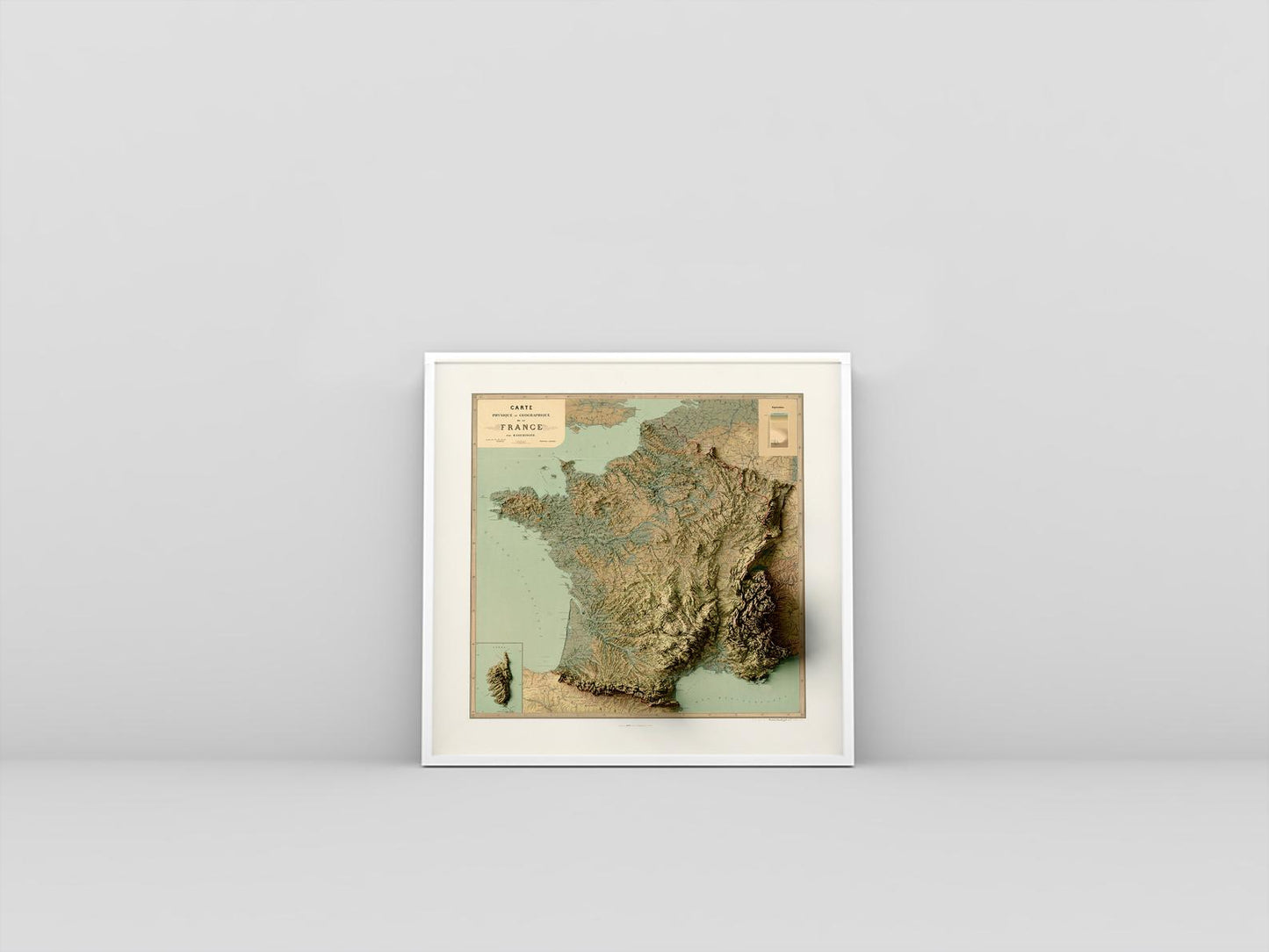 France vintage framed shaded relief map in white frame. Artistic print highlighting mountains with a realistic 3d effect