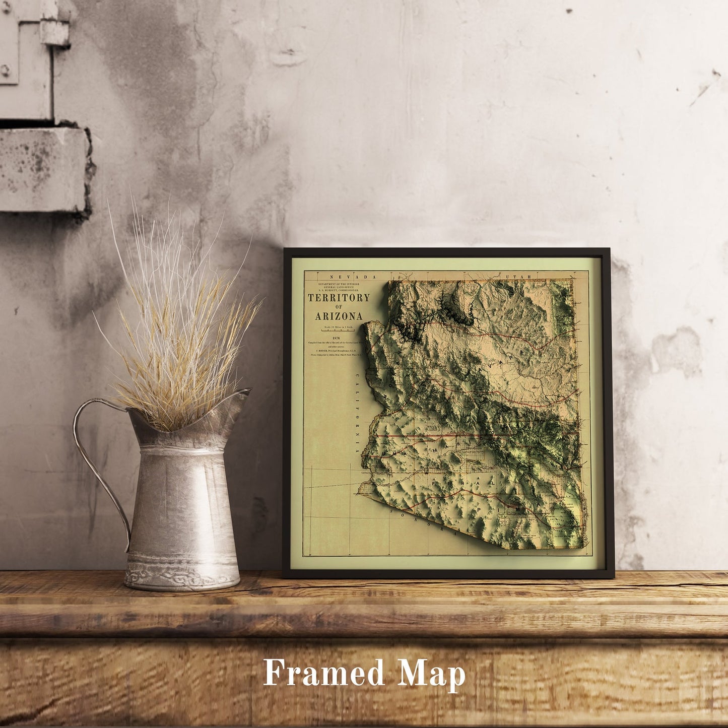 Vintage Arizona (USA) shaded relief map in black frame. Realistic terrain art print for home decor, displayed on rustic wooden table