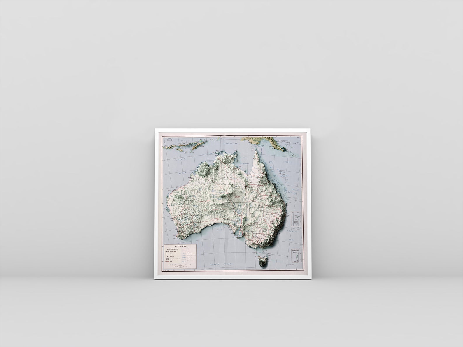 Australia vintage framed shaded relief map in white frame. Artistic print highlighting mountains with a realistic 3d effect