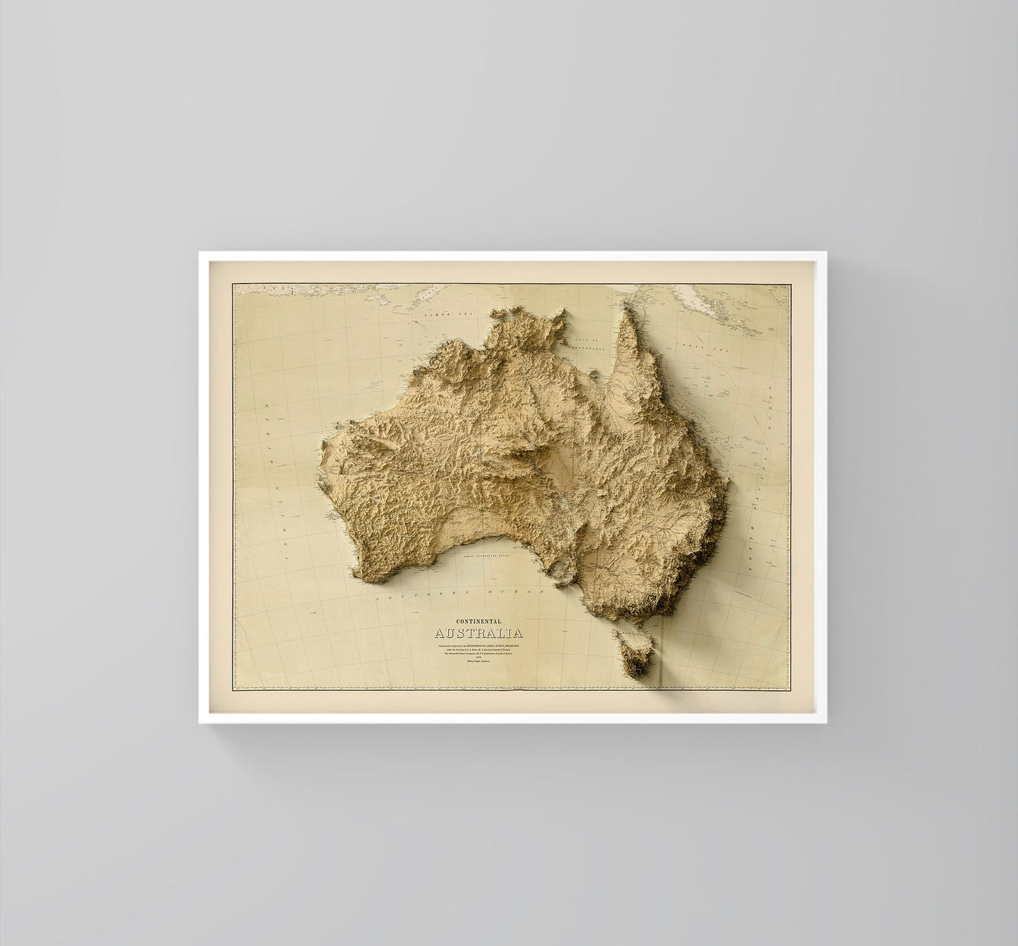 Australia vintage framed shaded relief map in white frame. Artistic print highlighting mountains with a realistic 3d effect