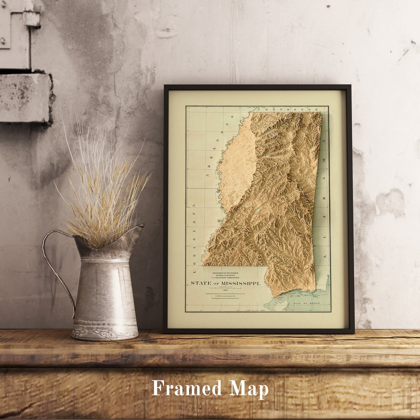 Vintage Mississippi (USA) shaded relief map in black frame. Realistic terrain art print for home decor, displayed on rustic wooden table
