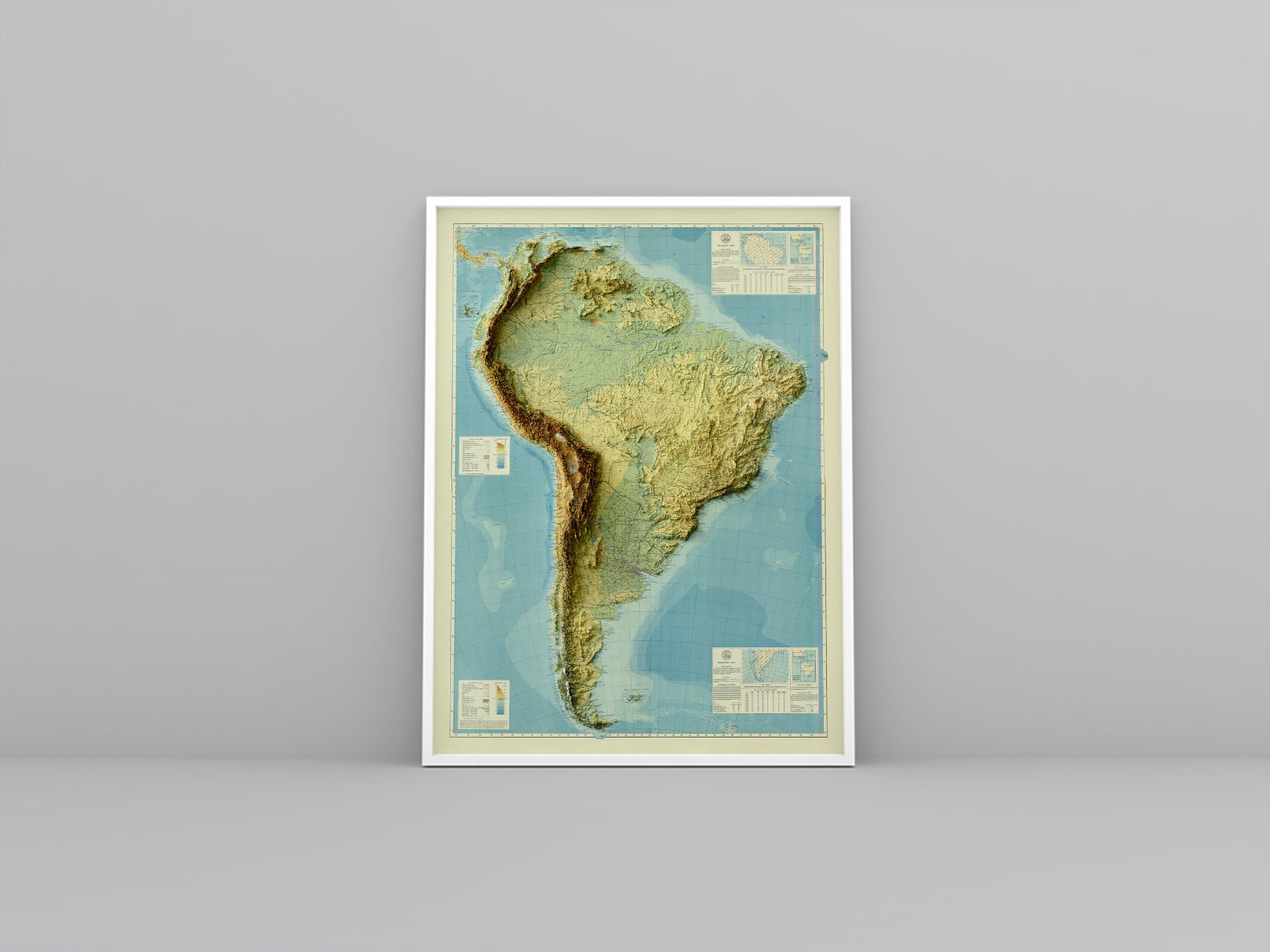 South America vintage framed shaded relief map in white frame. Artistic print highlighting mountains with a realistic 3d effect