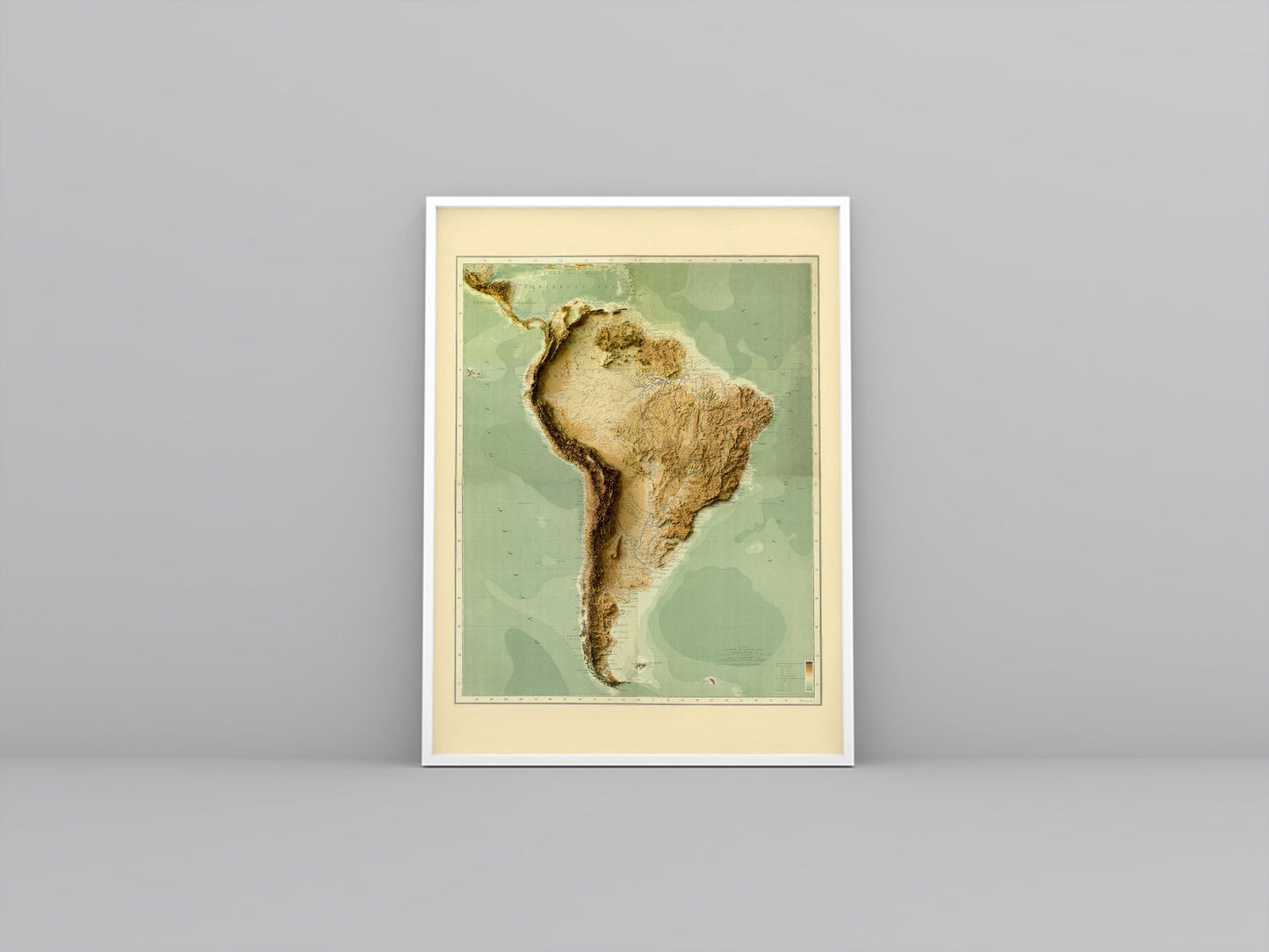 South America vintage framed shaded relief map in white frame. Artistic print highlighting mountains with a realistic 3d effect