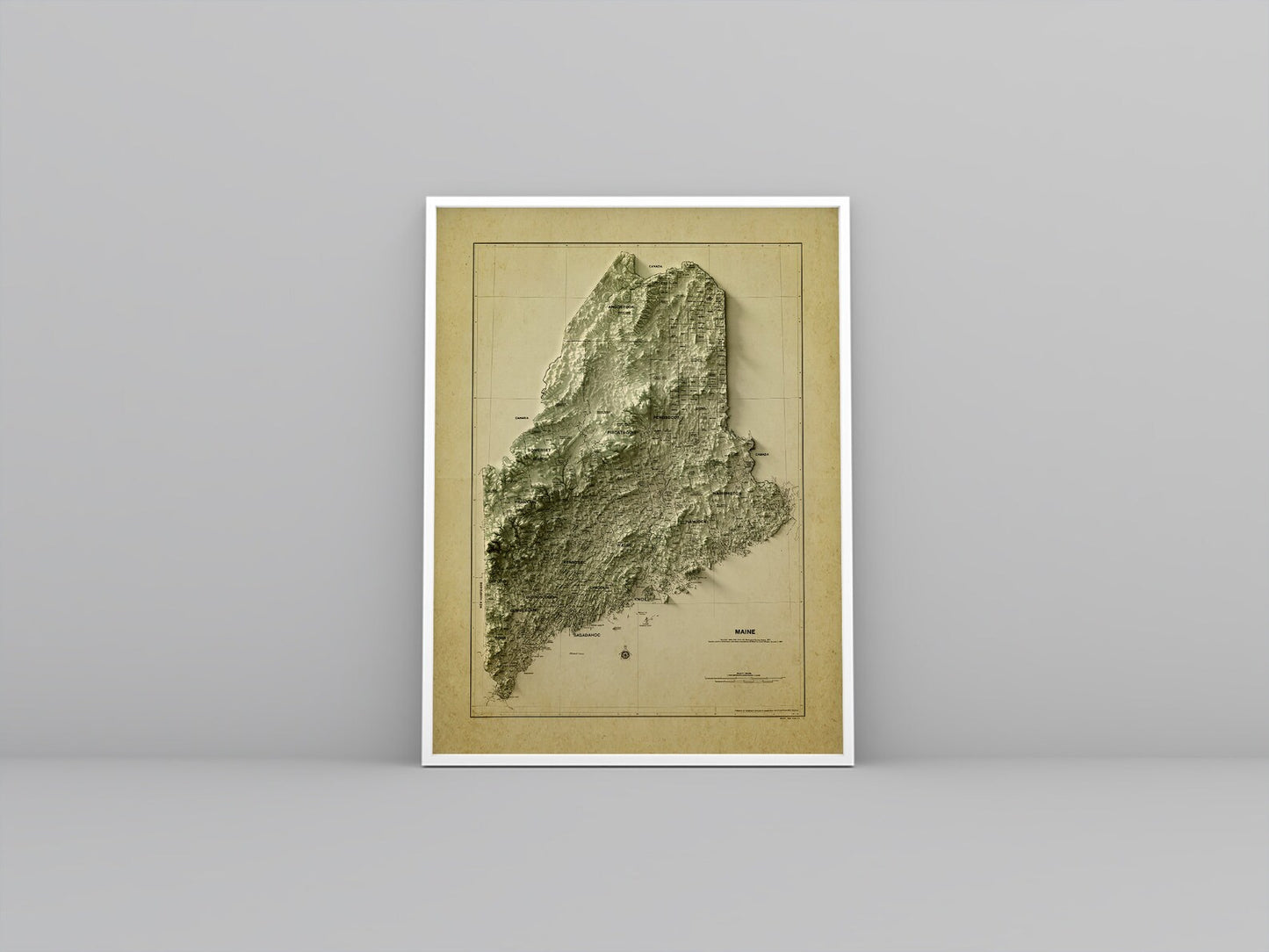 Maine (USA) vintage framed shaded relief map in white frame. Artistic print highlighting mountains with a realistic 3d effect