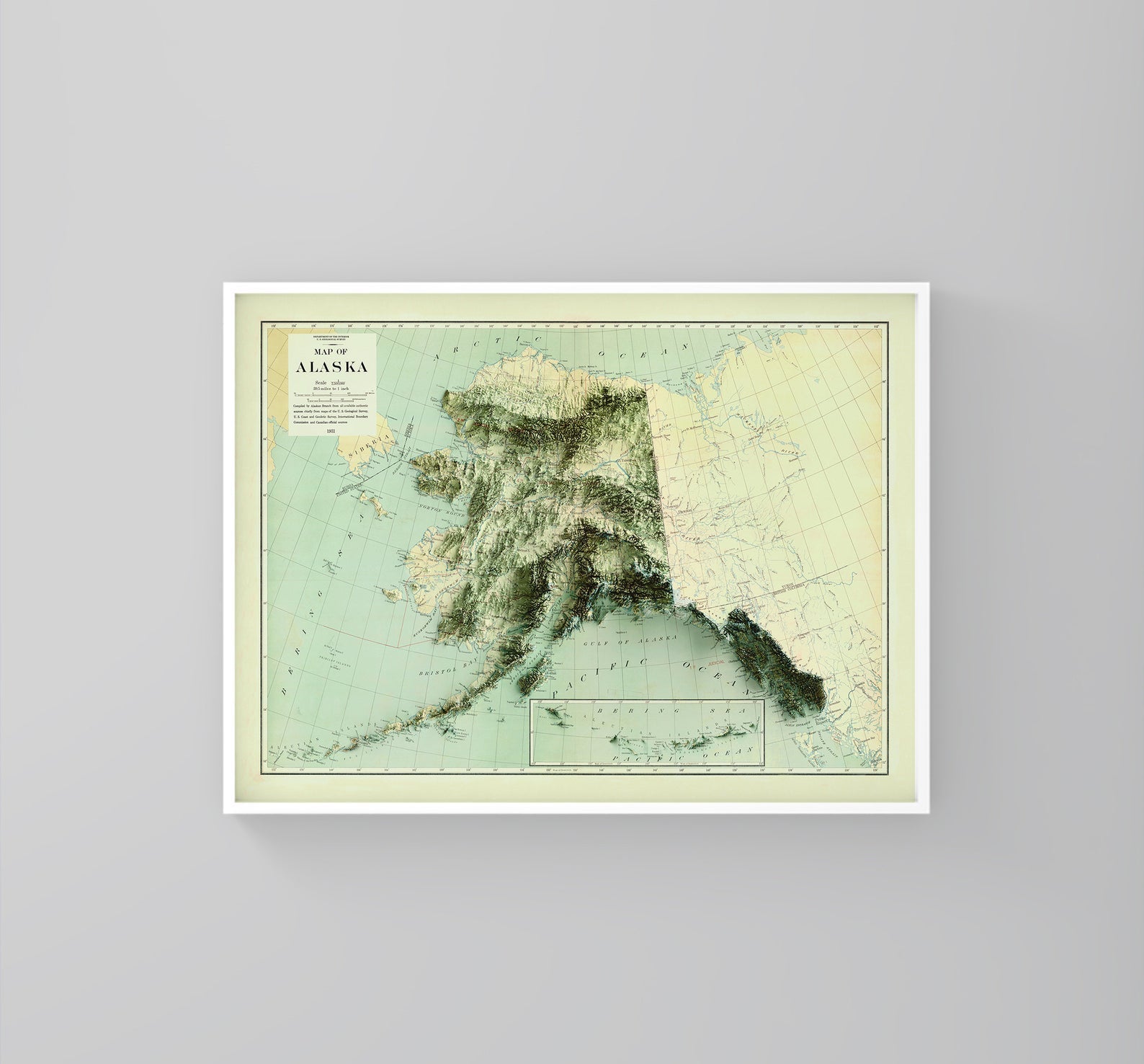 Alaska (USA) vintage framed shaded relief map in white frame. Artistic print highlighting mountains with a realistic 3d effect