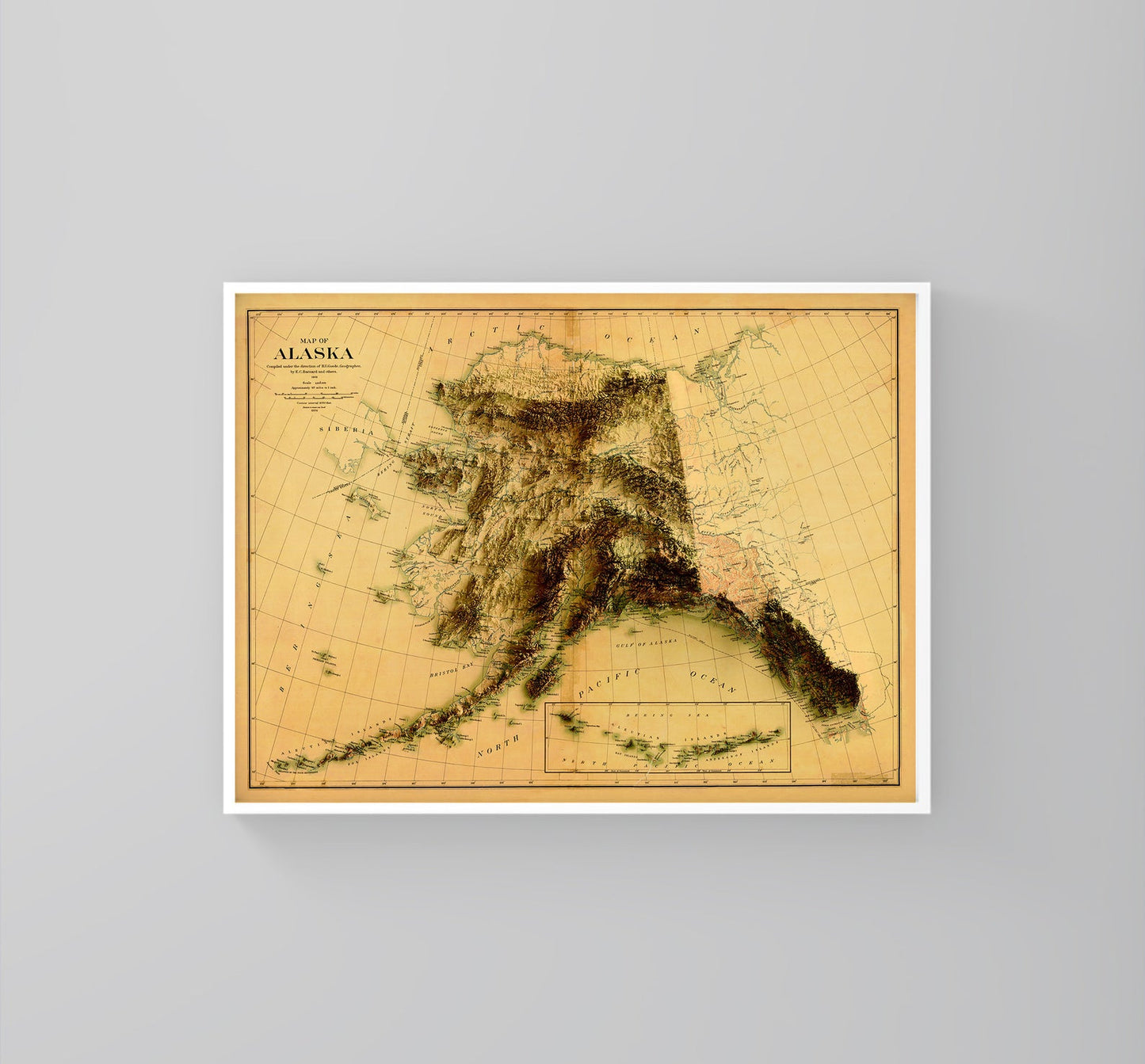 Alaska (USA) vintage framed shaded relief map in white frame. Artistic print highlighting mountains with a realistic 3d effect