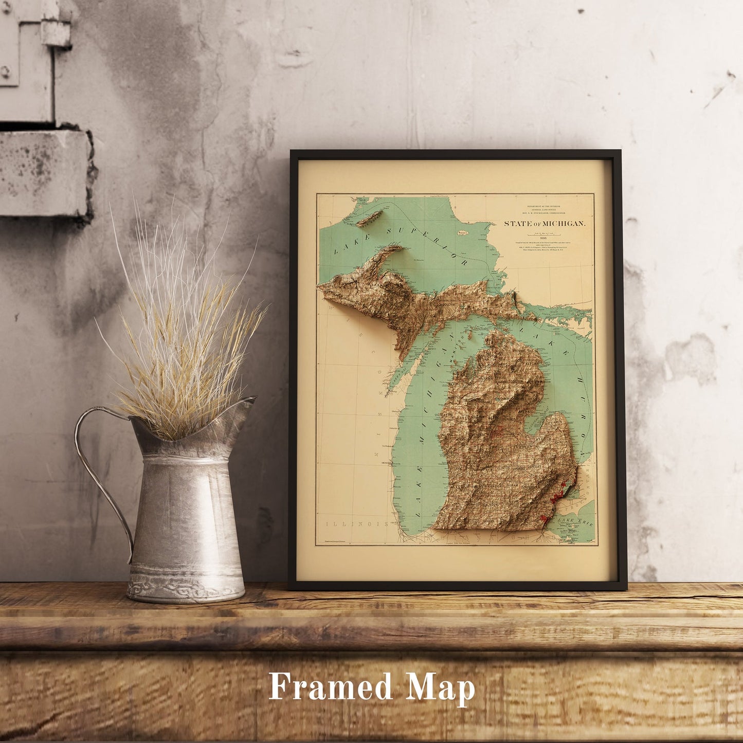 Vintage Michigan (USA) shaded relief map in black frame. Realistic terrain art print for home decor, displayed on rustic wooden table