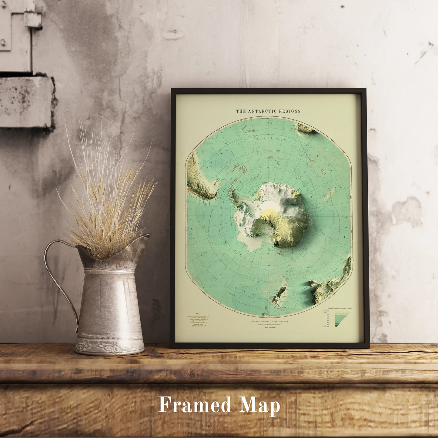 Vintage Antartctic shaded relief map in black frame. Realistic terrain art print for home decor, displayed on rustic wooden table