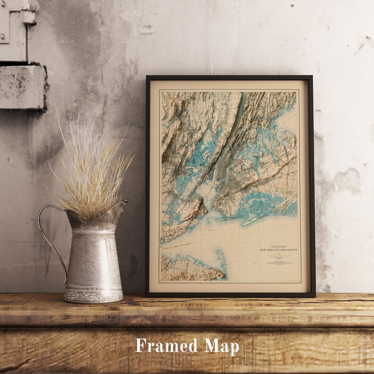 Vintage New York City shaded relief map in black frame. Realistic terrain art print for home decor, displayed on rustic wooden table