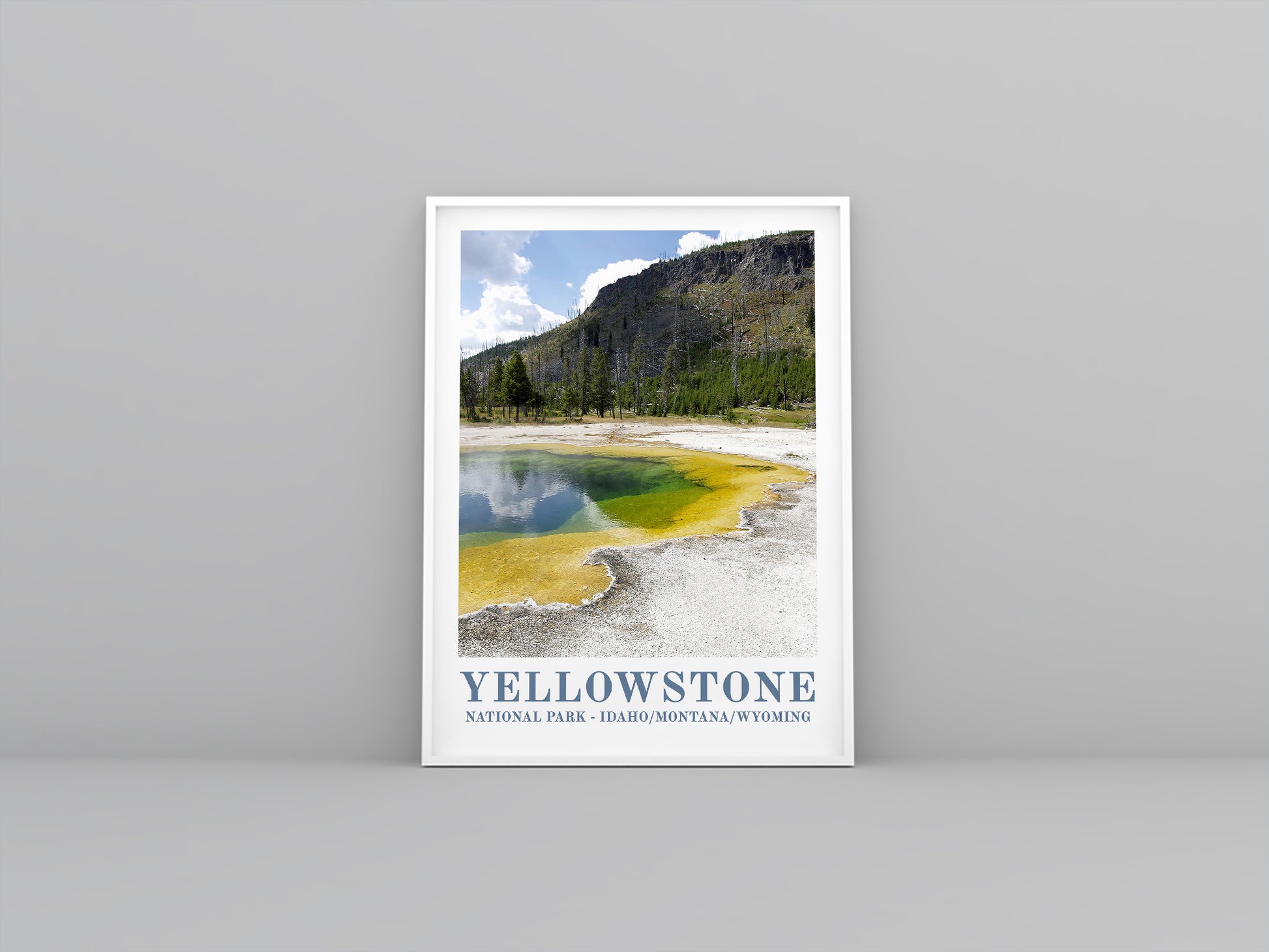 Yellowstone Vintage travel poster in white frame. Artistic print highlighting the landscape