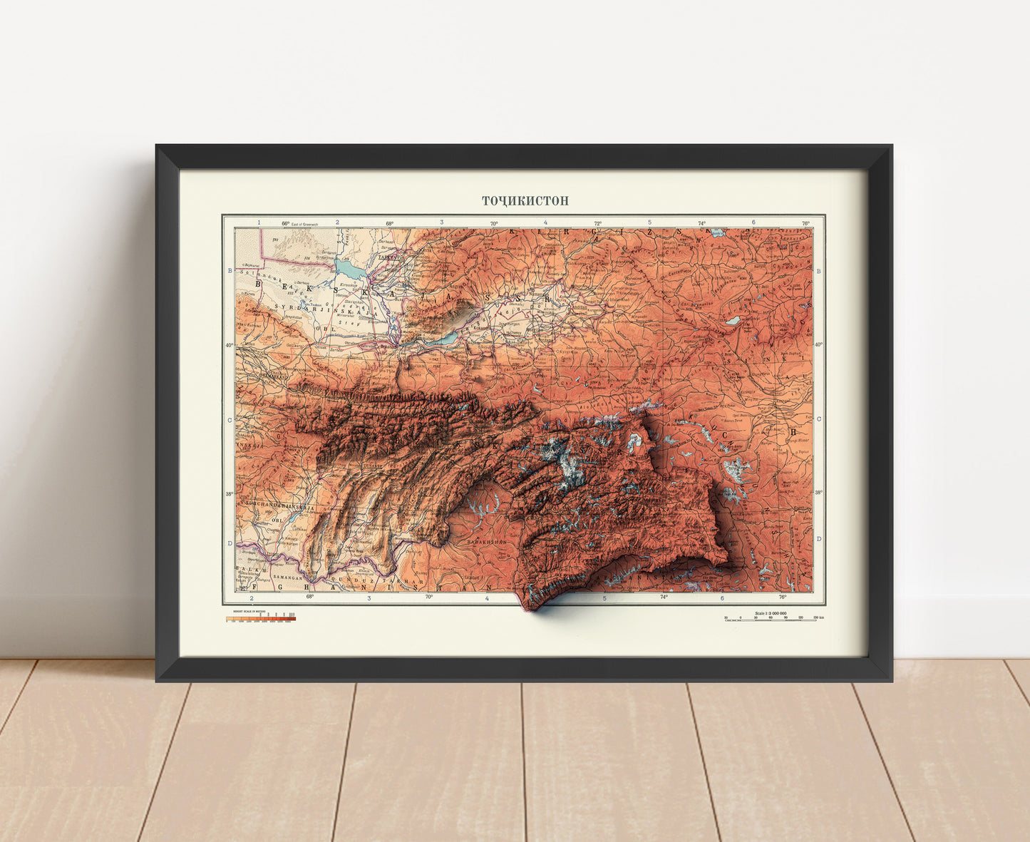 Vintage Tajikistan shaded relief map in black frame. Artistic print with realistic terrain effect for wall decor