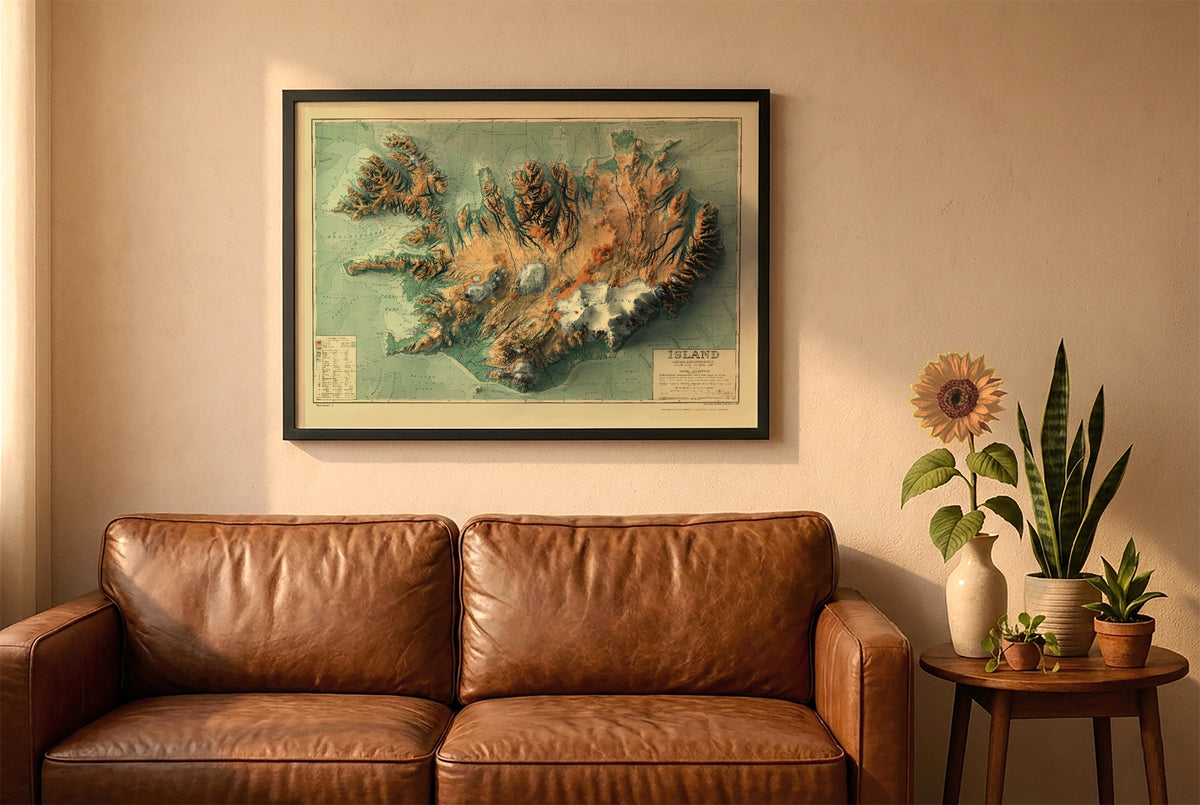 Iceland vintage relief map in a black frame above a brown leather sofa. Boho living room with warm sunlight, sunflower, and indoor plants on a wooden side table