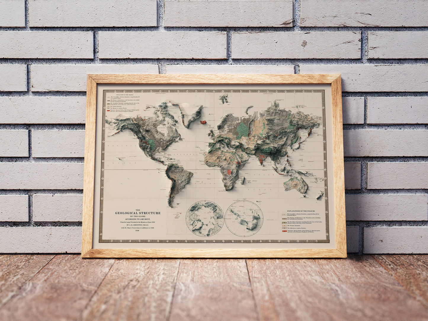 Vintage World shaded relief map in a wooden frame. Realistic terrain art print for home decor, displayed against a brick wall