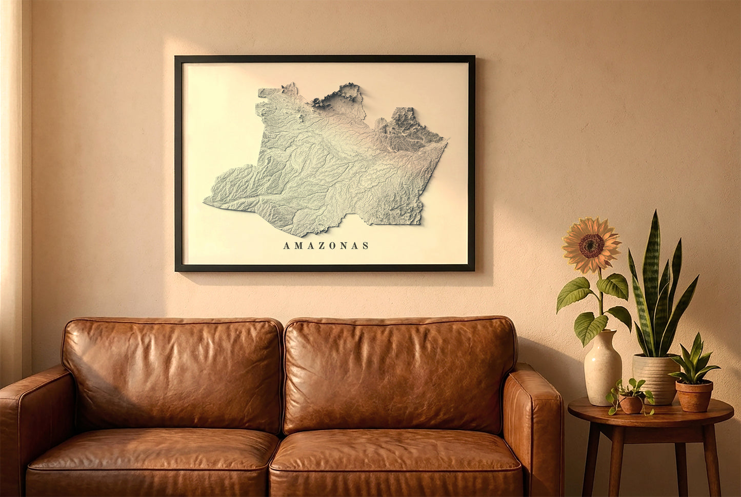Amazonas state, Brazil, relief map in a black frame above a brown leather sofa. Boho living room with warm sunlight, sunflower, and indoor plants on a wooden side table