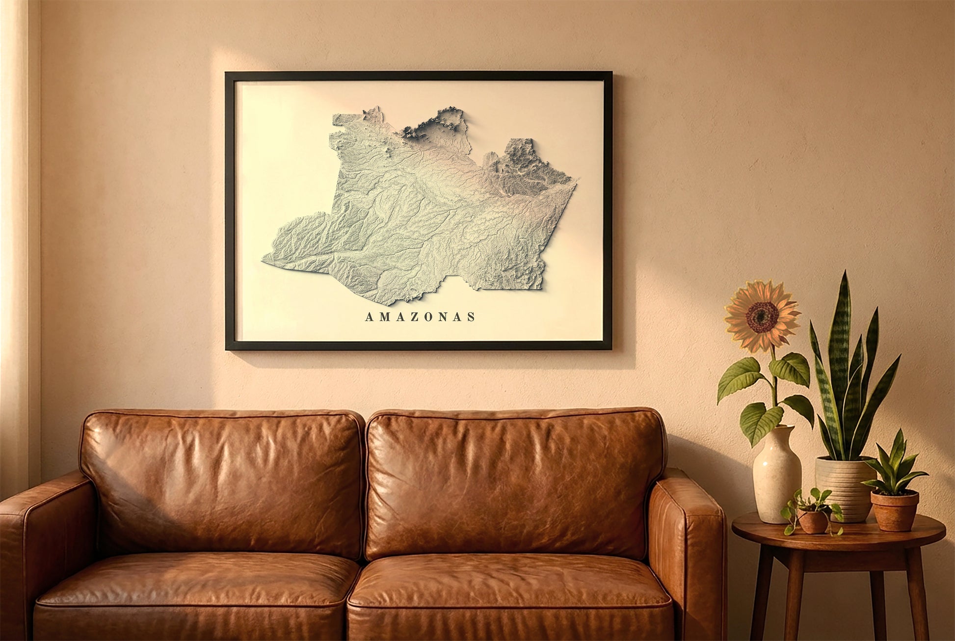 Amazonas state, Brazil, relief map in a black frame above a brown leather sofa. Boho living room with warm sunlight, sunflower, and indoor plants on a wooden side table