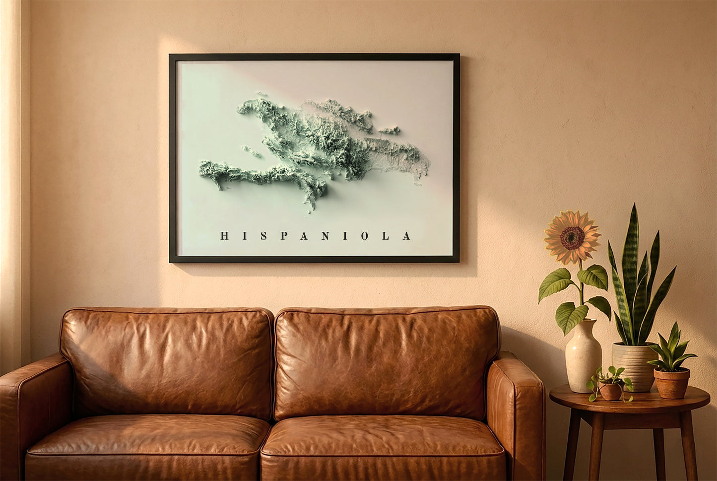 Hispaniola Island relief map in a black frame above a brown leather sofa. Boho living room with warm sunlight, sunflower, and indoor plants on a wooden side table