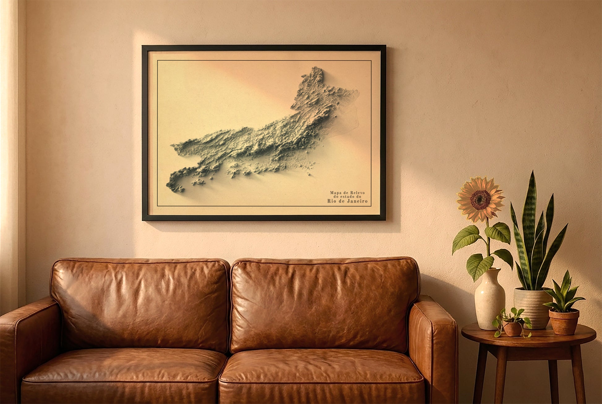 Rio de Janeiro, Brazil, vintage relief map in a black frame above a brown leather sofa. Boho living room with warm sunlight, sunflower, and indoor plants on a wooden side table
