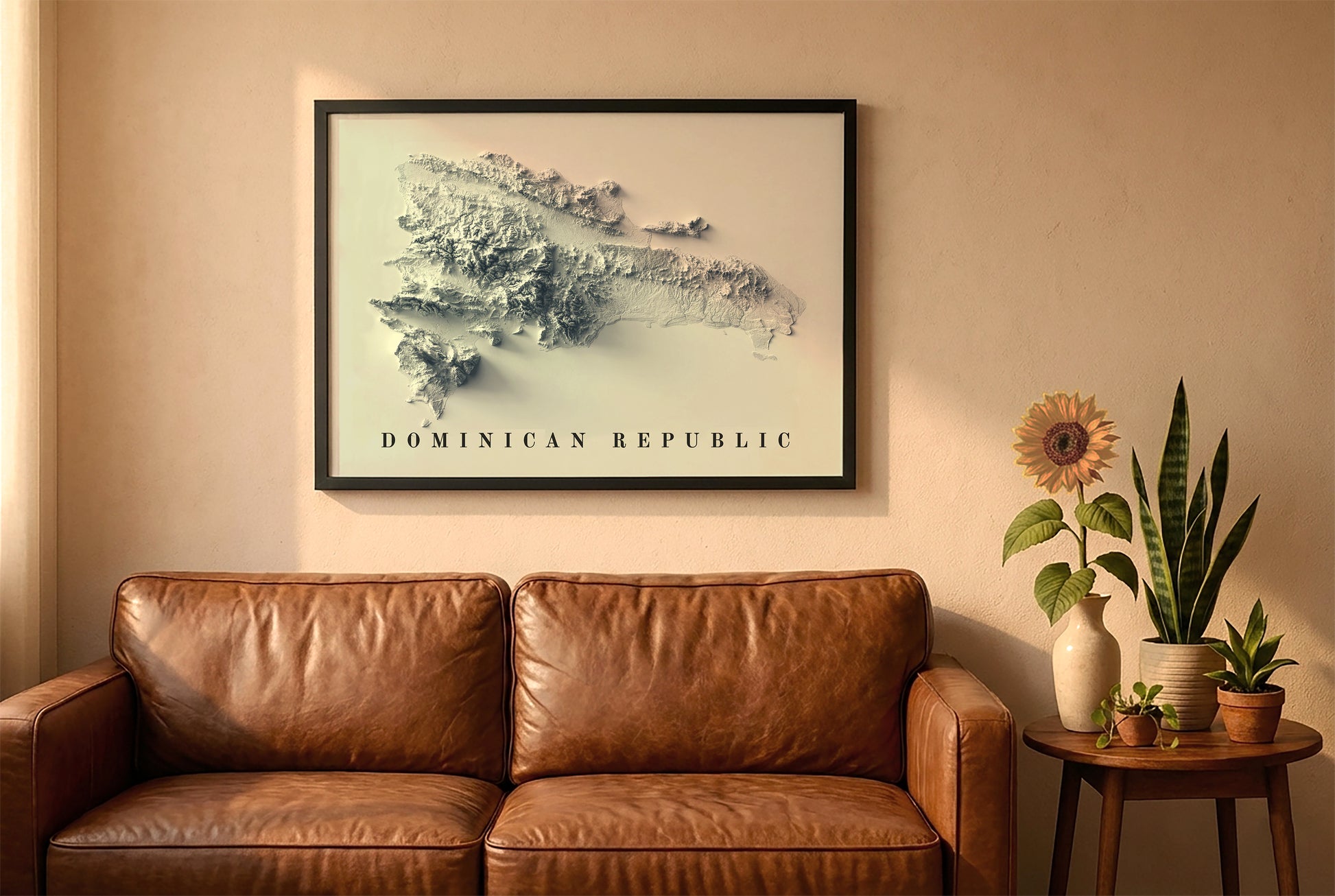 Dominican Republic relief map in a black frame above a brown leather sofa. Boho living room with warm sunlight, sunflower, and indoor plants on a wooden side table