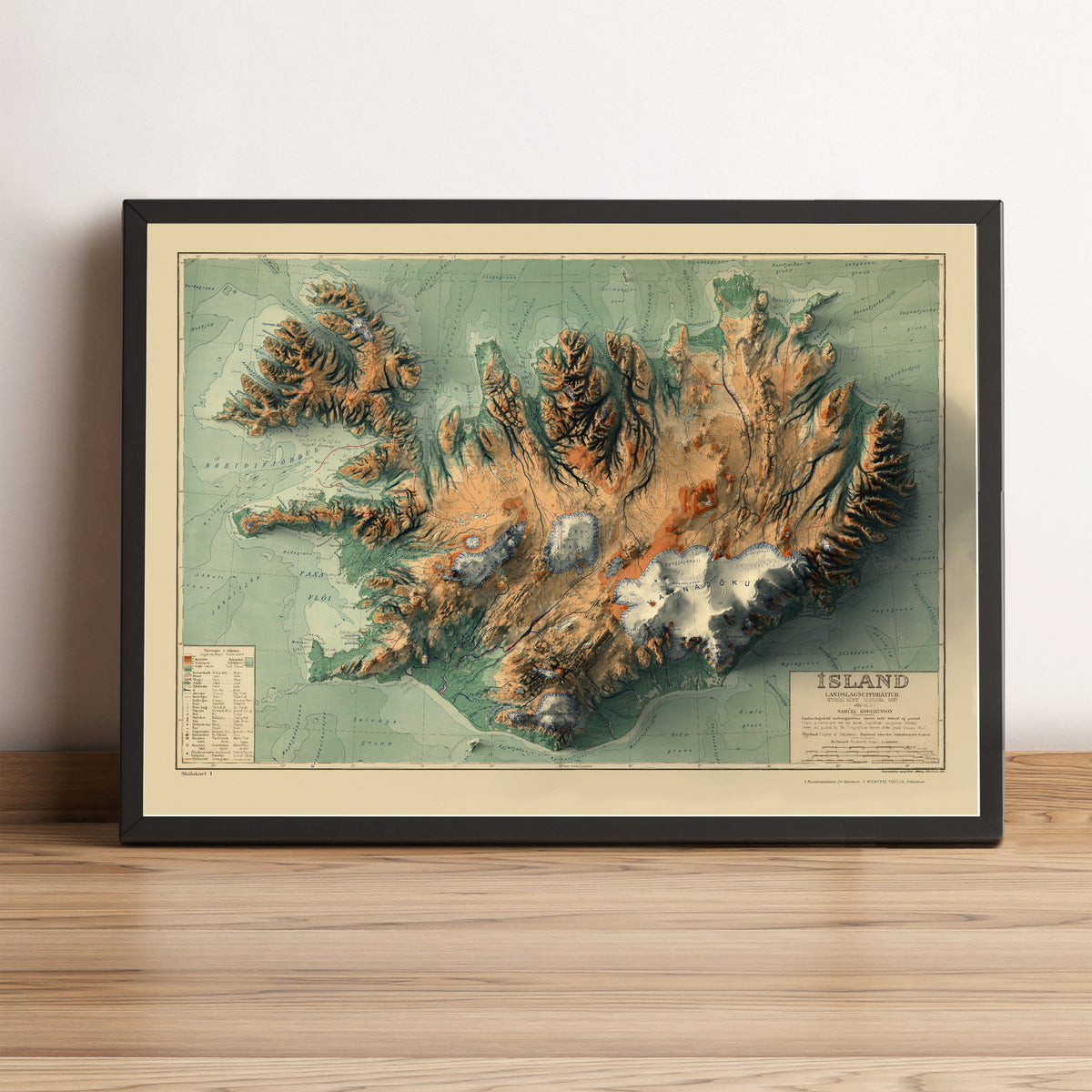 Iceland vintage framed shaded relief map in black frame. Artistic print highlighting mountains with a realistic terrain effect