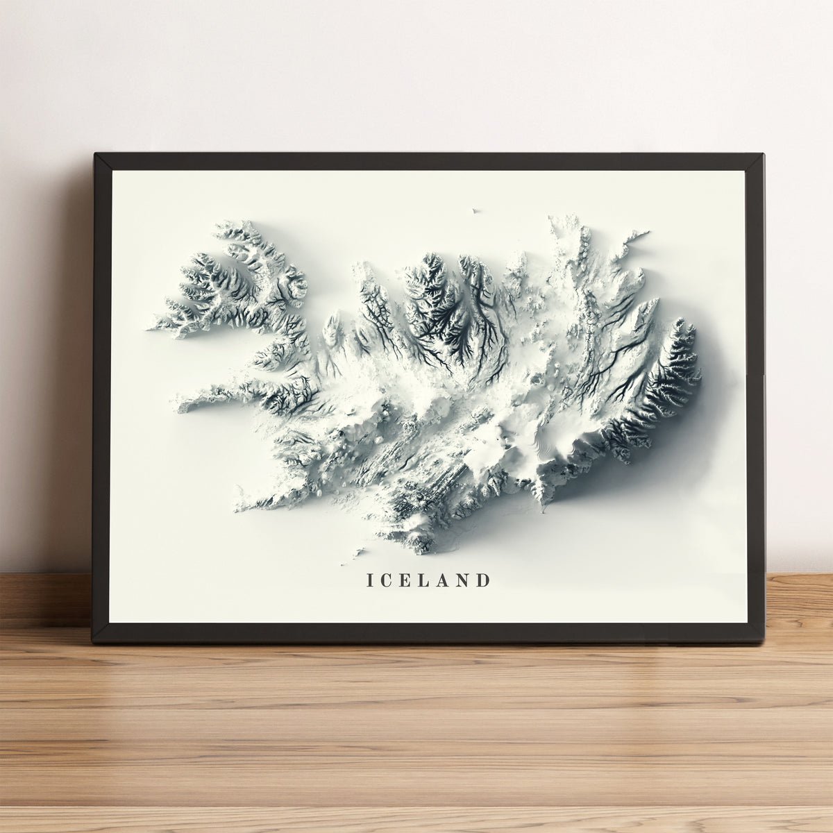 Iceland framed shaded relief map in black frame. Artistic print highlighting mountains with a realistic terrain effect
