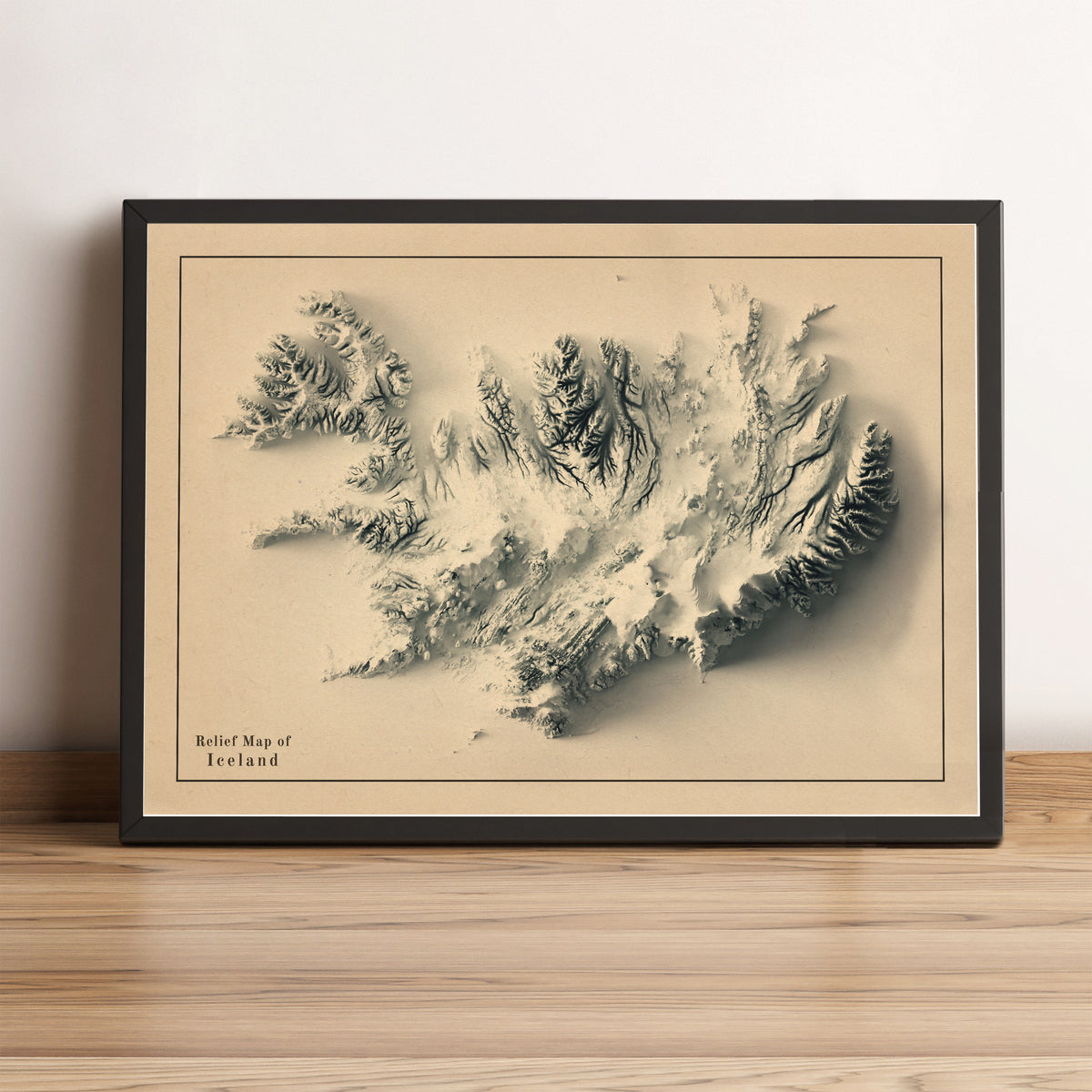 Iceland framed shaded relief map in black frame. Artistic print highlighting mountains with a realistic terrain effect