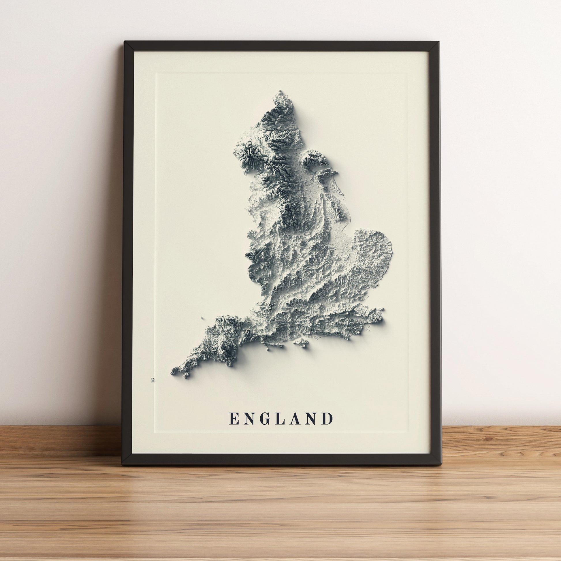 England framed shaded relief map in black frame. Artistic print highlighting mountains with a realistic terrain effect