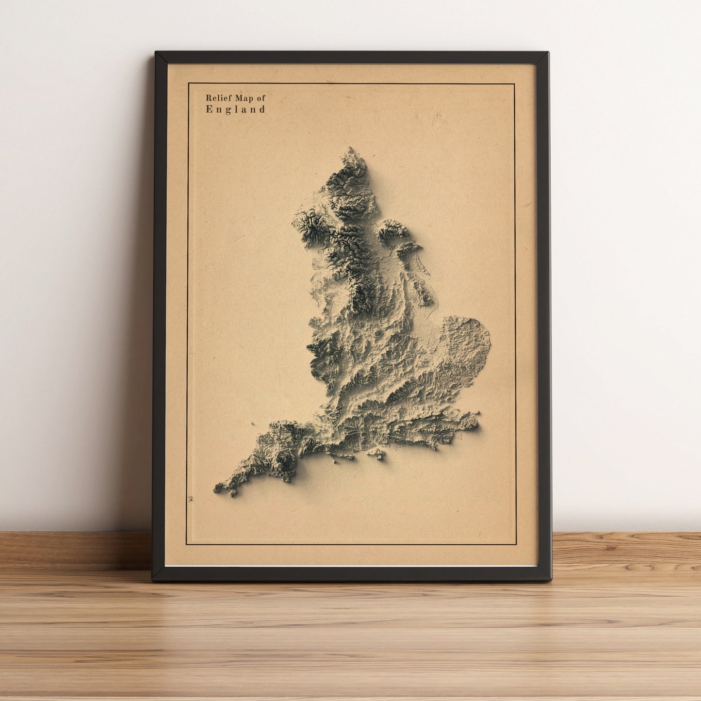 England framed shaded relief map in black frame. Artistic print highlighting mountains with a realistic terrain effect