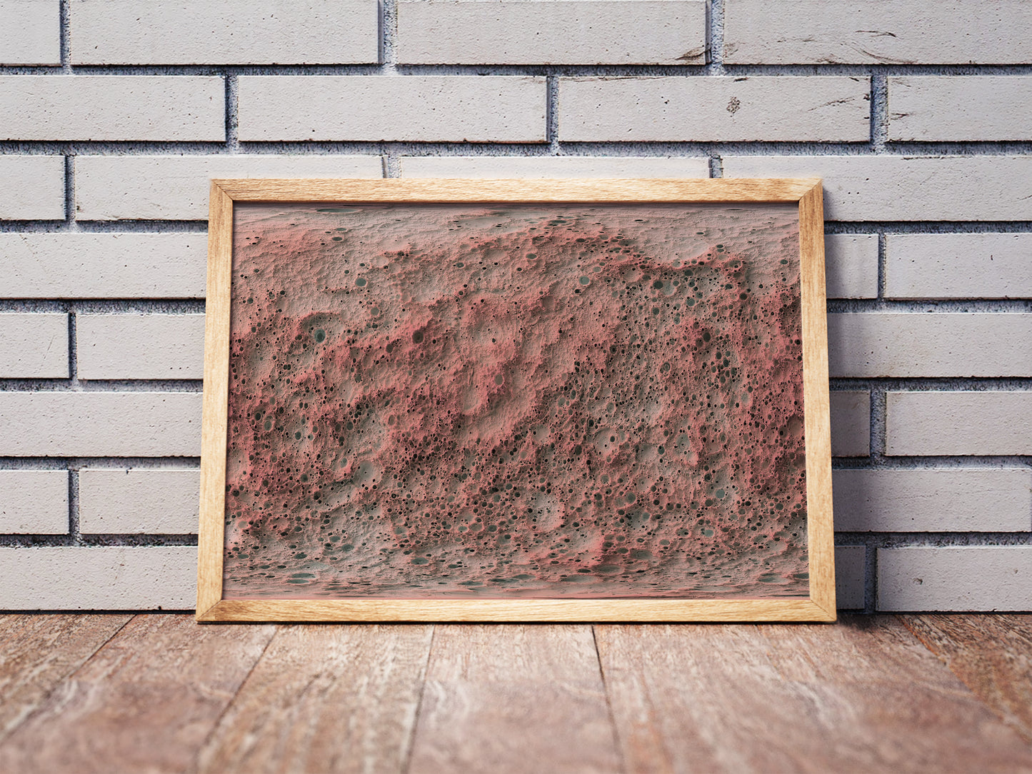 Mercury shaded relief map in a wooden frame. Realistic terrain art print for home decor, displayed against a brick wall