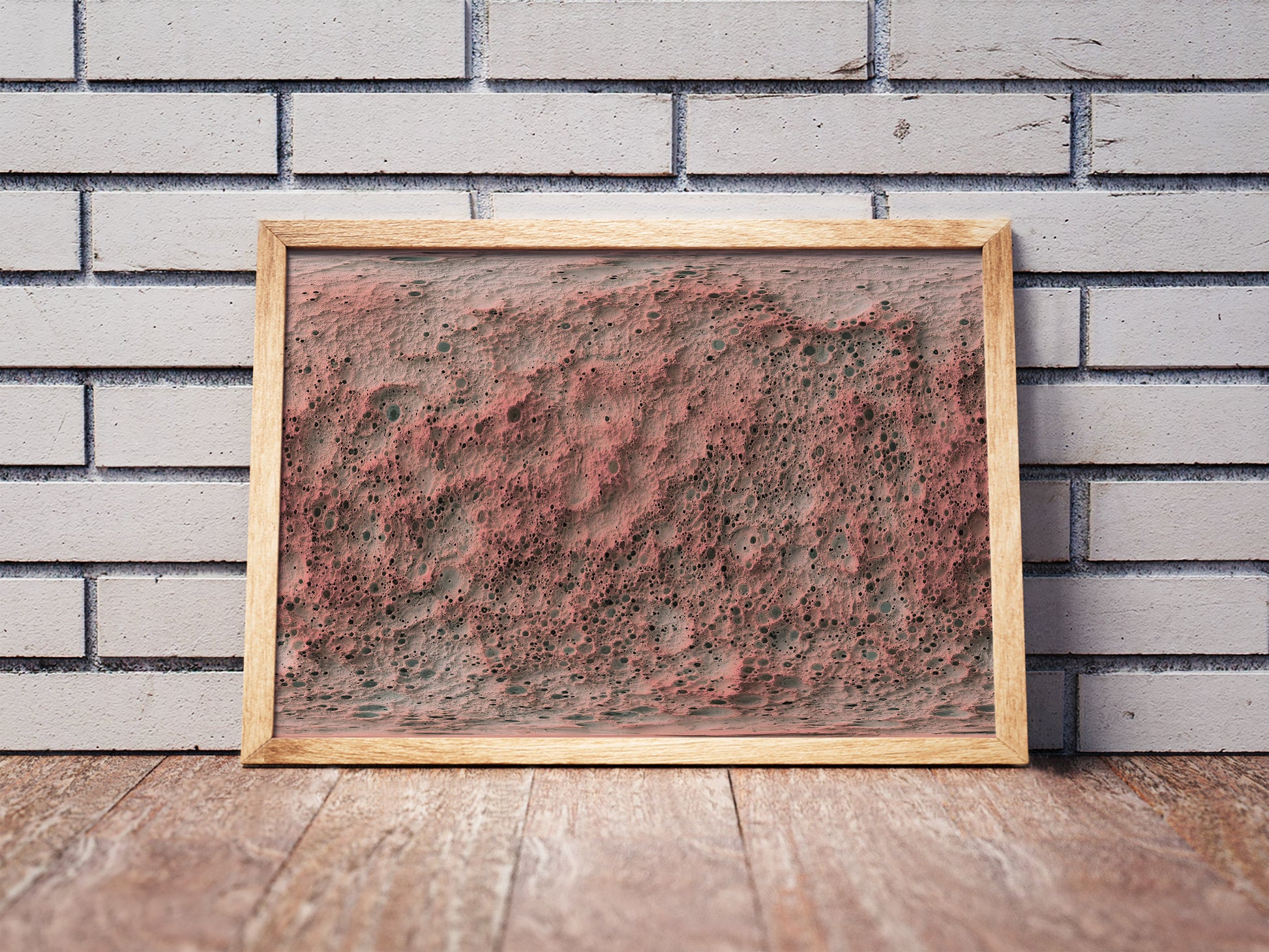 Mercury shaded relief map in a wooden frame. Realistic terrain art print for home decor, displayed against a brick wall