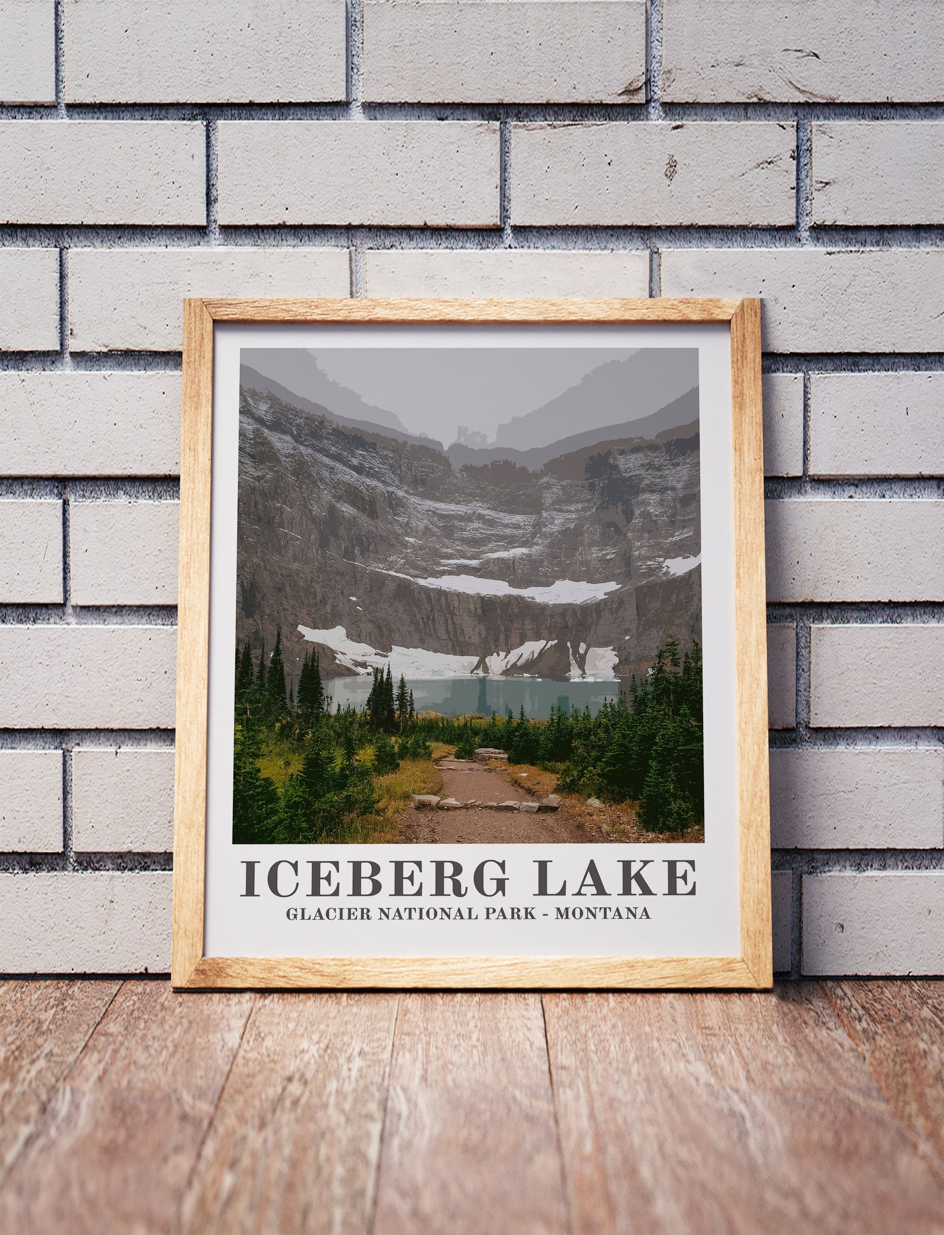 Glacier National Park poster in a wooden frame. Realistic terrain art print for home decor, displayed against a brick wall