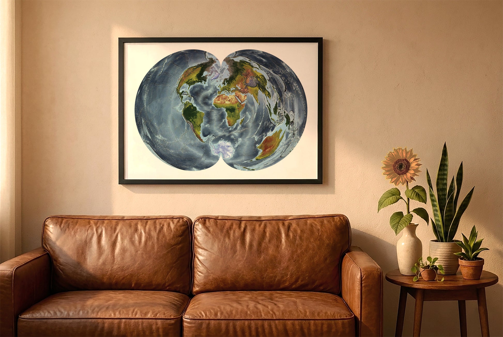 World relief map in polyconic projection in a black frame above a brown leather sofa. Boho living room with warm sunlight, sunflower, and indoor plants on a wooden side table