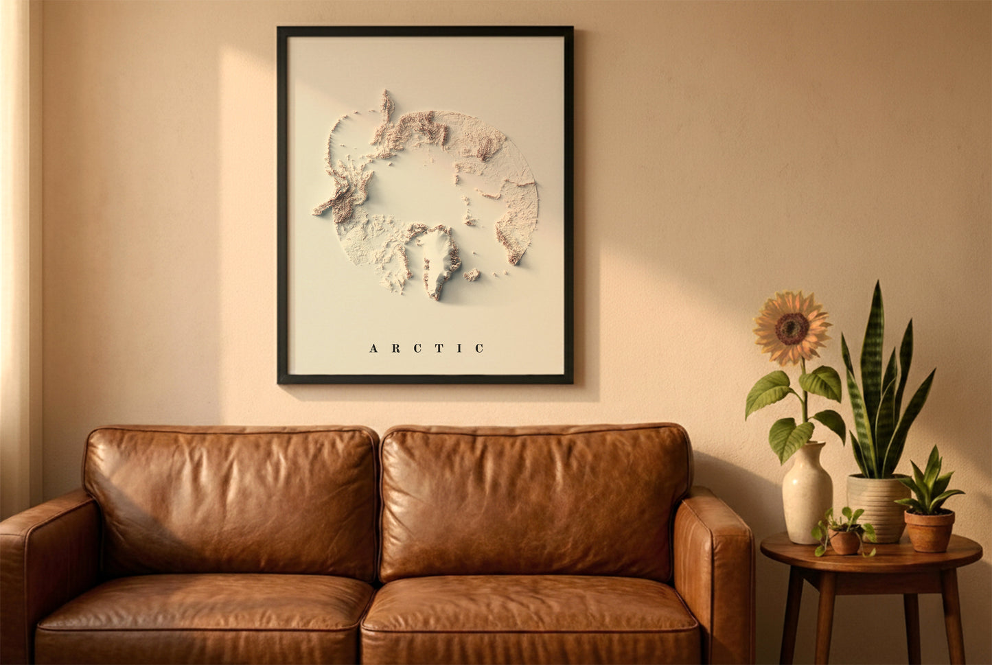 Arctic relief map in a black frame above a brown leather sofa. Boho living room with warm sunlight, sunflower, and indoor plants on a wooden side table