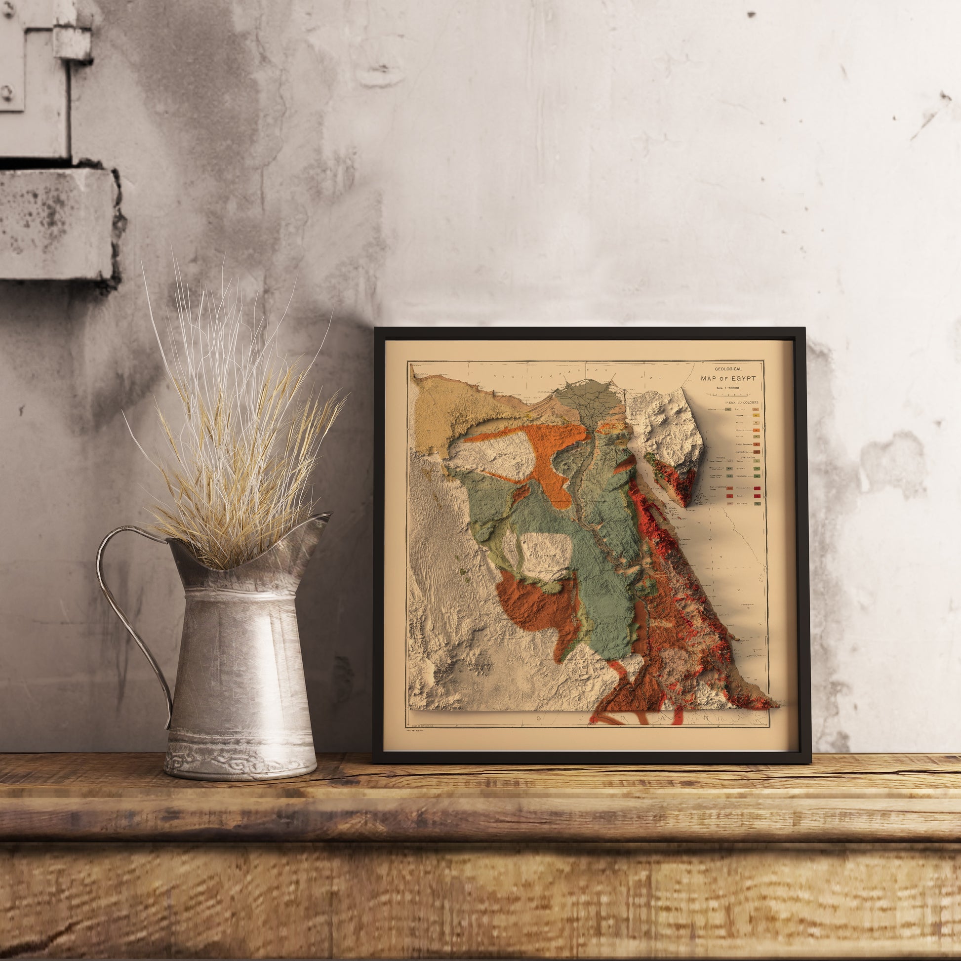 Vintage Egypt shaded relief map in black frame. Realistic terrain art print for home decor, displayed on rustic wooden table