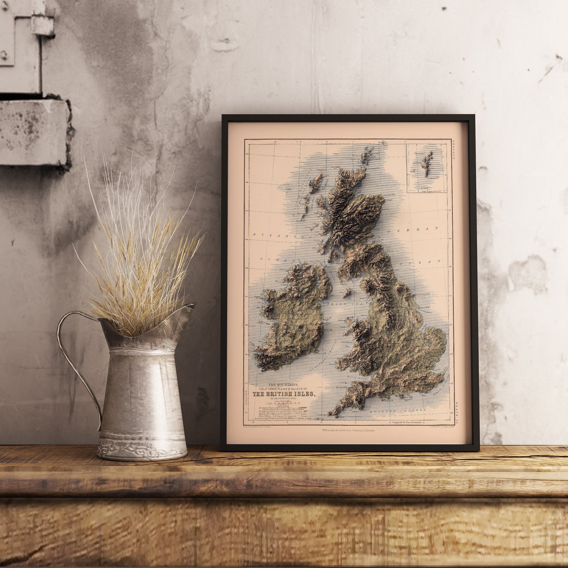 vintage united kingdom and ireland shaded relief map in black frame. Realistic terrain art print for home decor, displayed on rustic wooden table