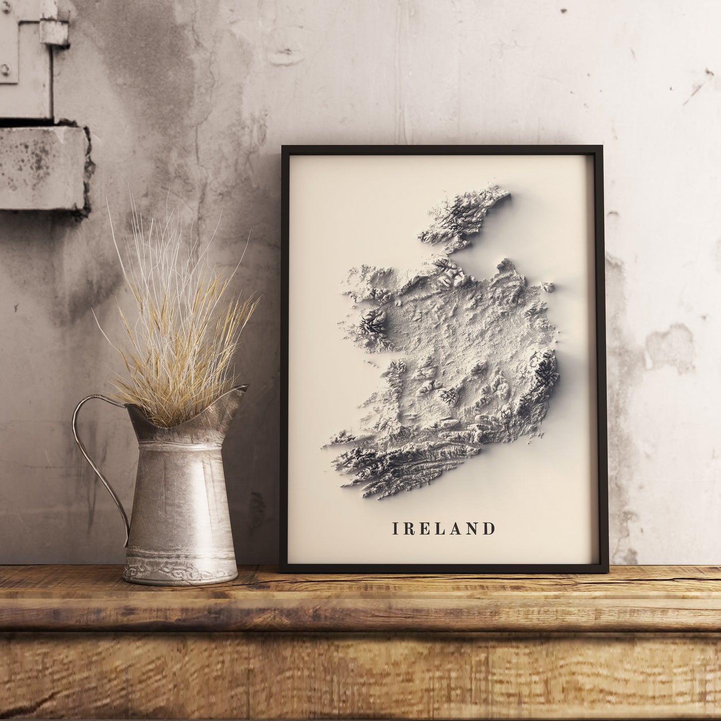 Ireland shaded relief map in black frame. Realistic terrain art print for home decor, displayed on rustic wooden table