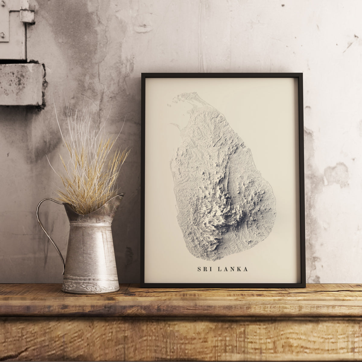 Sri Lanka shaded relief map in black frame. Realistic terrain art print for home decor, displayed on rustic wooden table