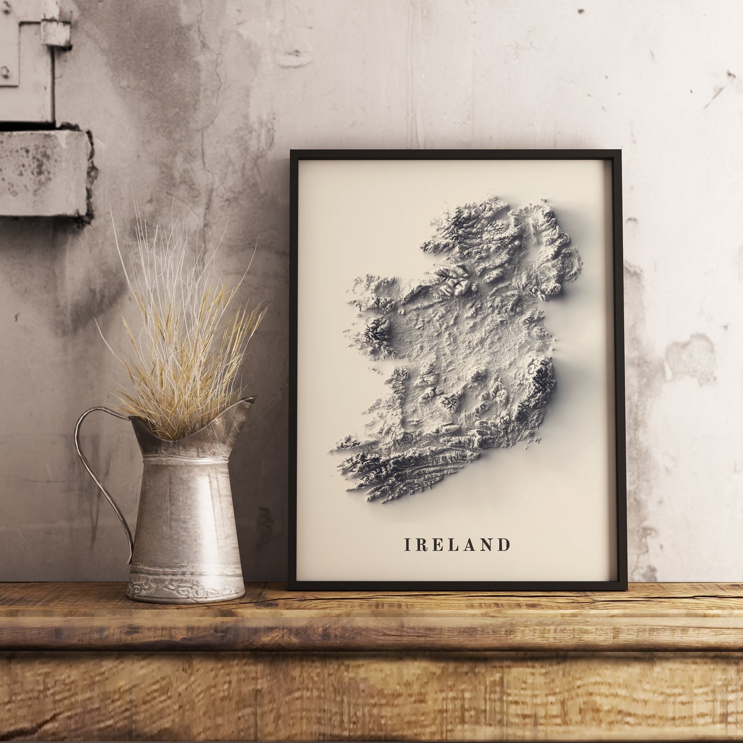 Ireland shaded relief map in black frame. Realistic terrain art print for home decor, displayed on rustic wooden table