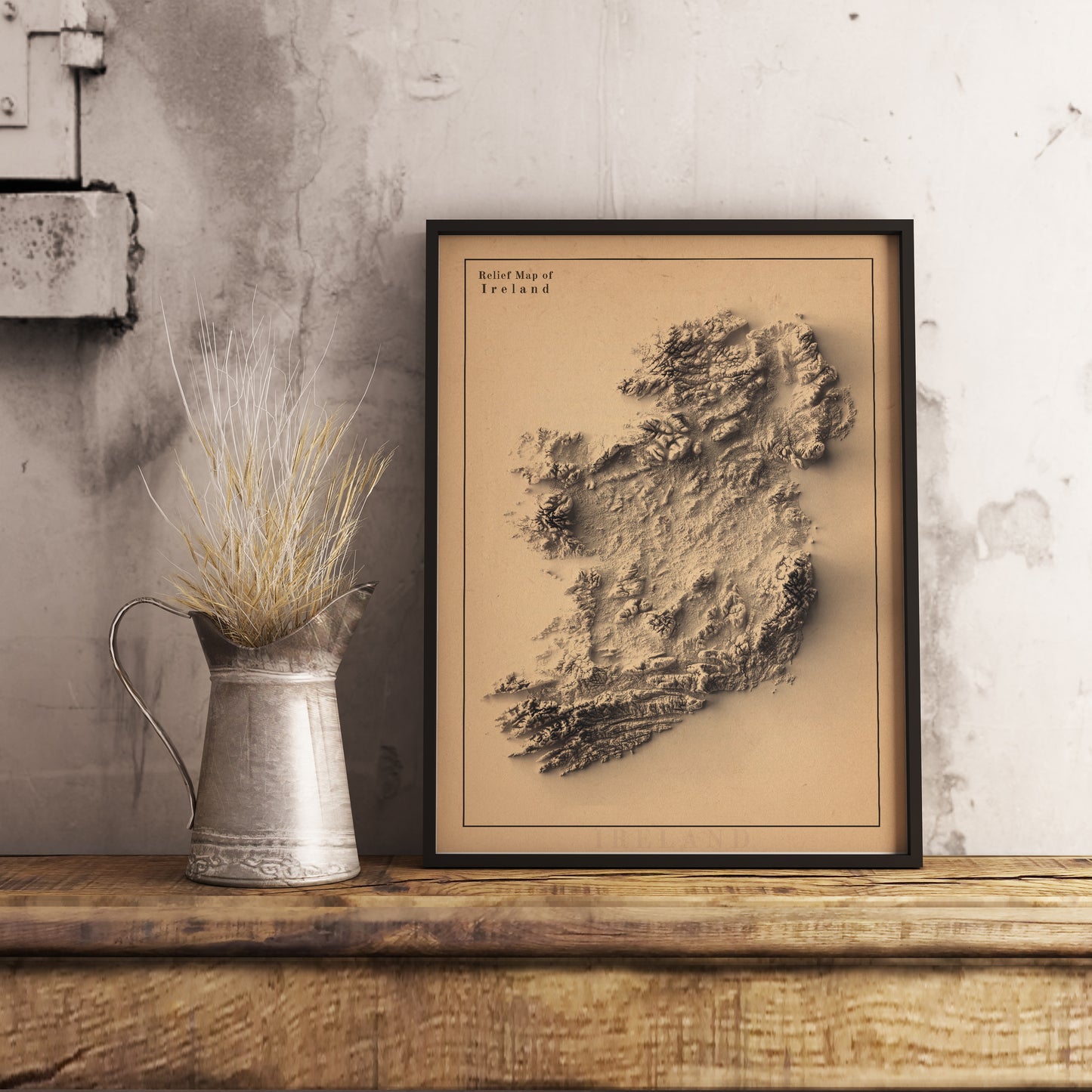 Ireland shaded relief map in black frame. Realistic terrain art print for home decor, displayed on rustic wooden table