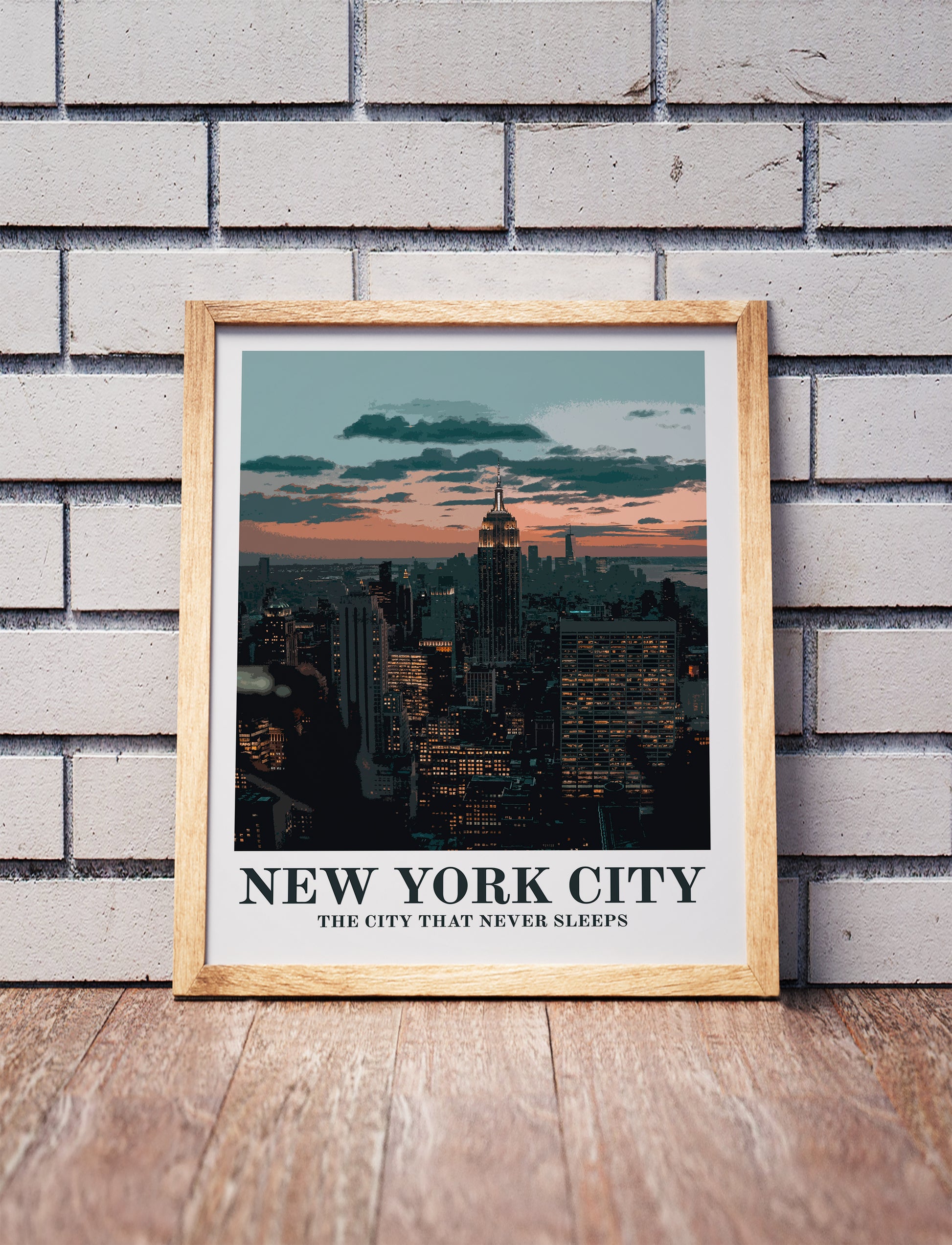 New York City poster in a wooden frame. Realistic terrain art print for home decor, displayed against a brick wall
