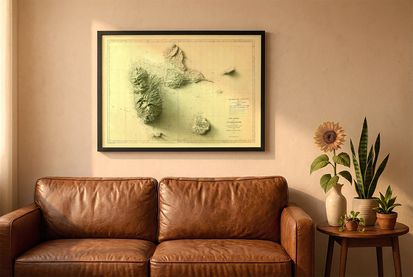 Guadeloupe, France, vintage relief map in a black frame above a brown leather sofa. Boho living room with warm sunlight, sunflower, and indoor plants on a wooden side table