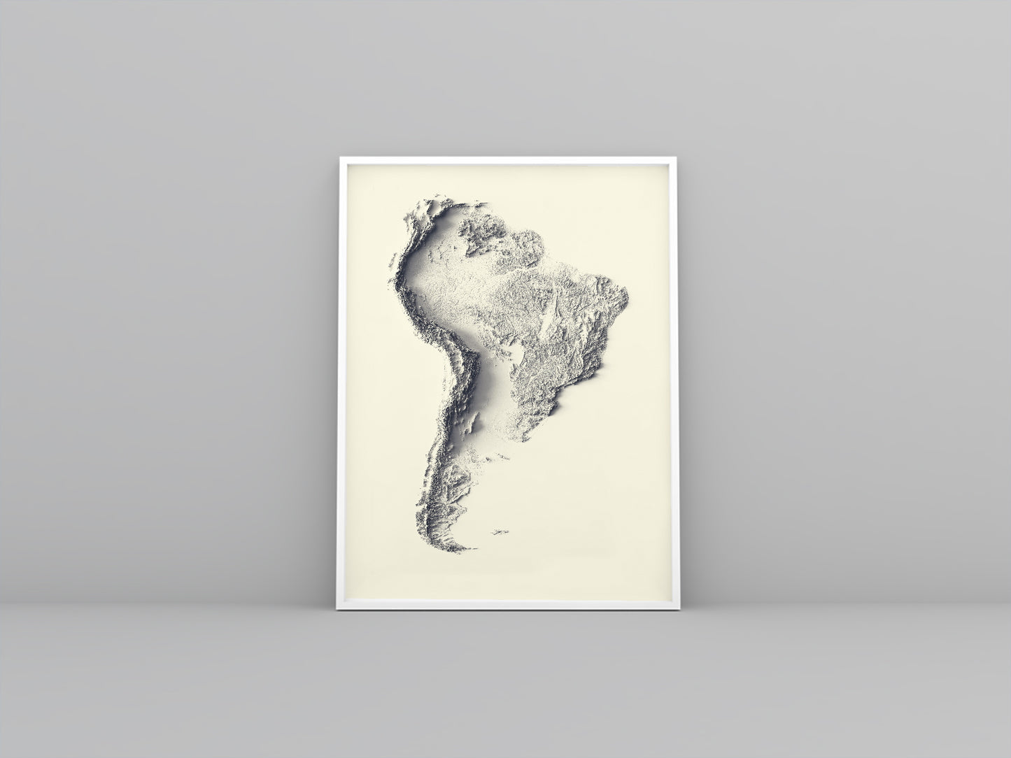 South America framed shaded relief map in white frame. Artistic print highlighting mountains with a realistic 3d effect