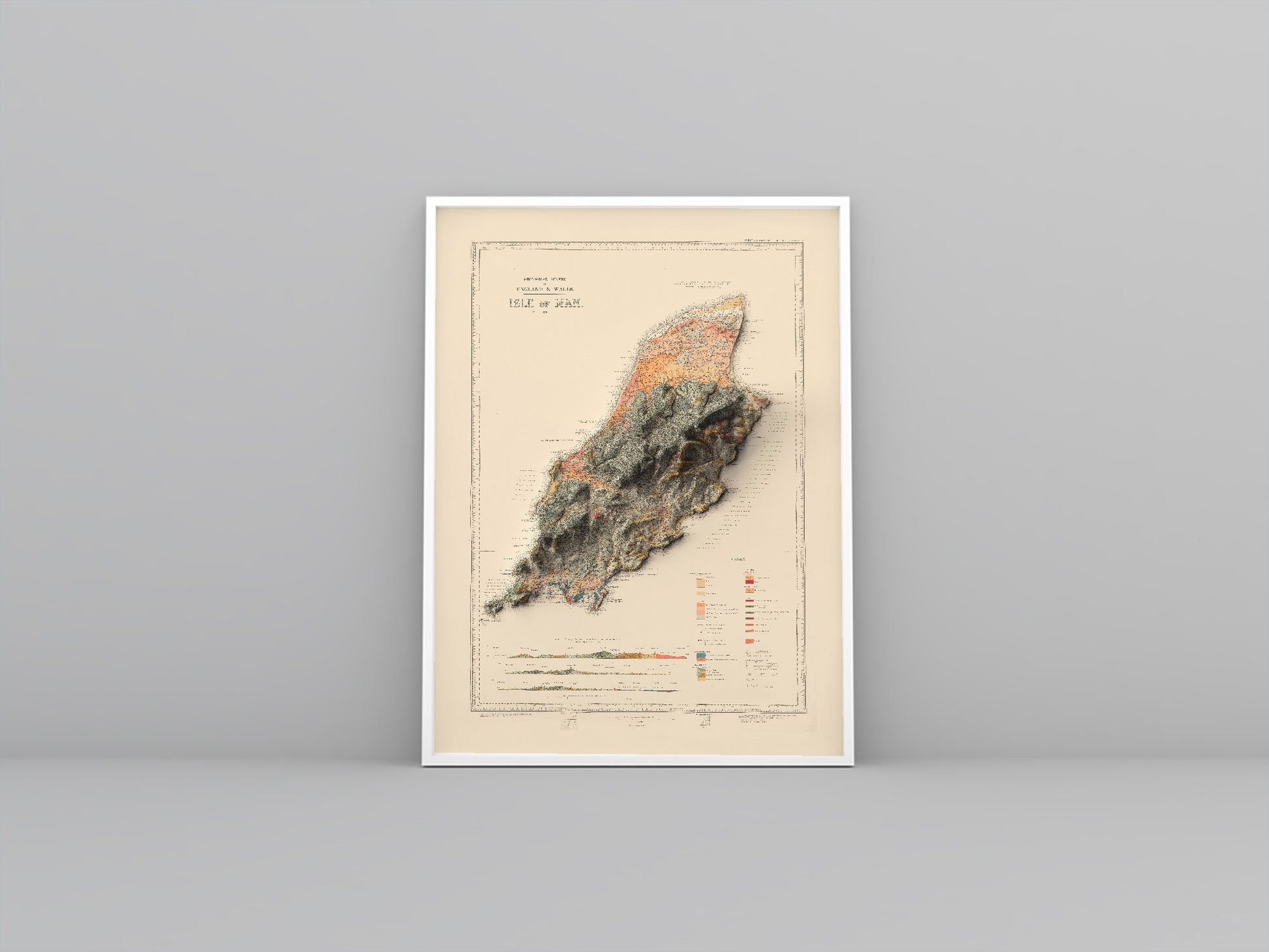 Isle of Man vintage framed shaded relief map in white frame. Artistic print highlighting mountains with a realistic 3d effect