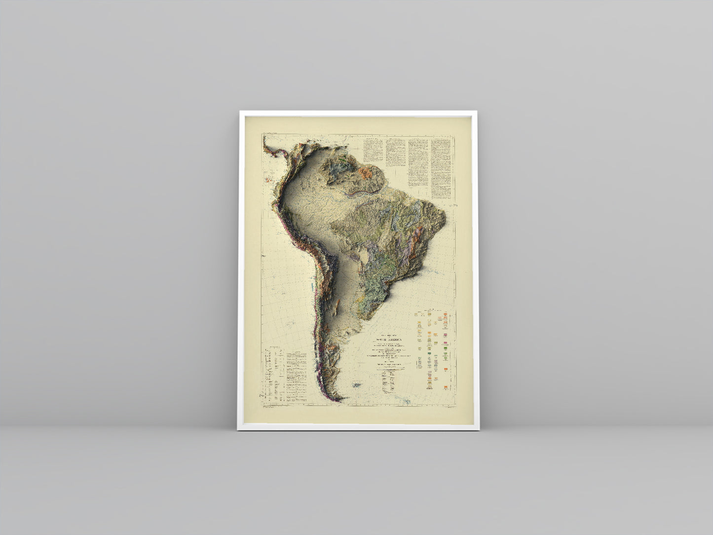 South America vintage framed shaded relief map in white frame. Artistic print highlighting mountains with a realistic 3d effect