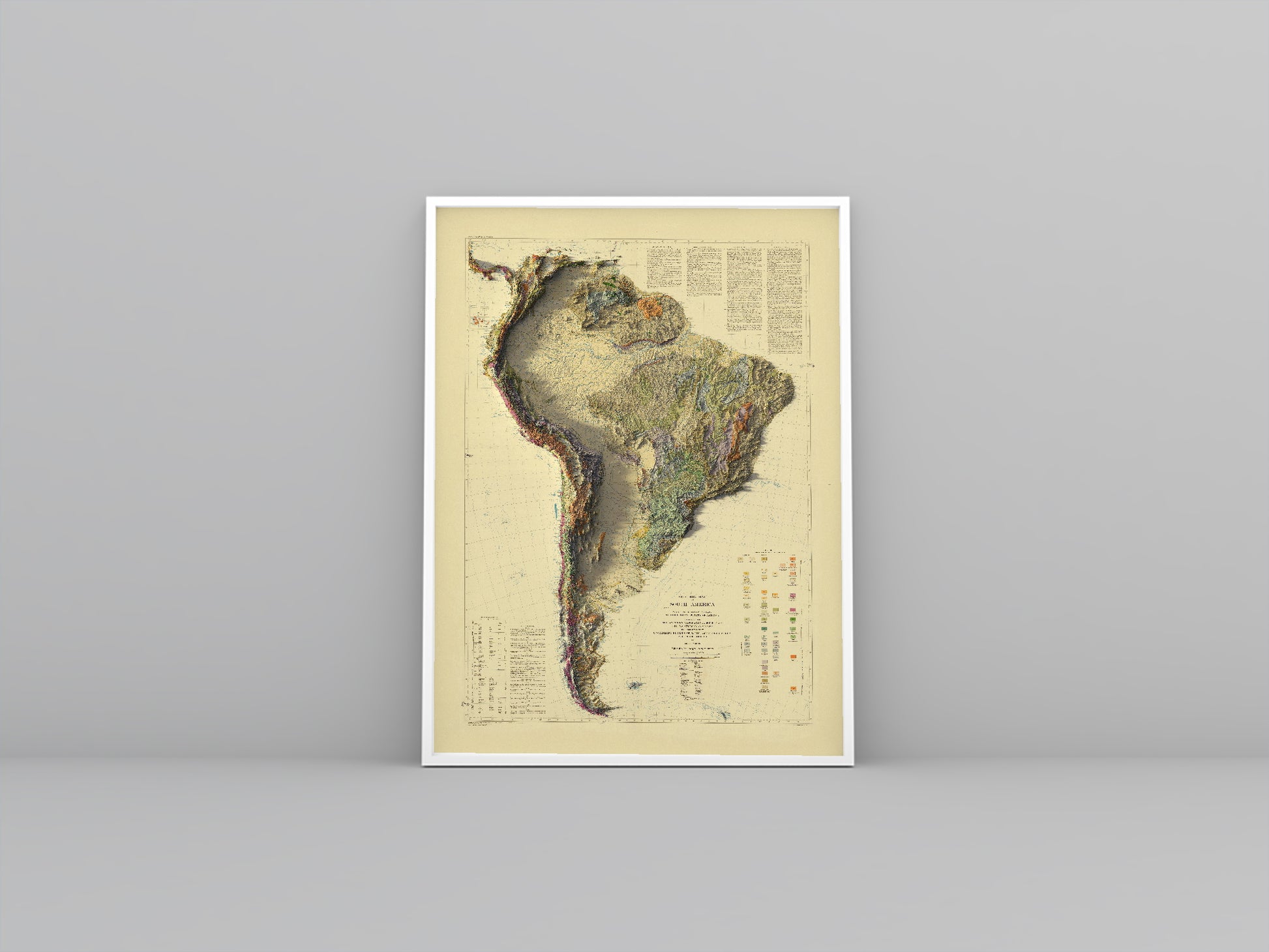 South America vintage framed shaded relief map in white frame. Artistic print highlighting mountains with a realistic 3d effect