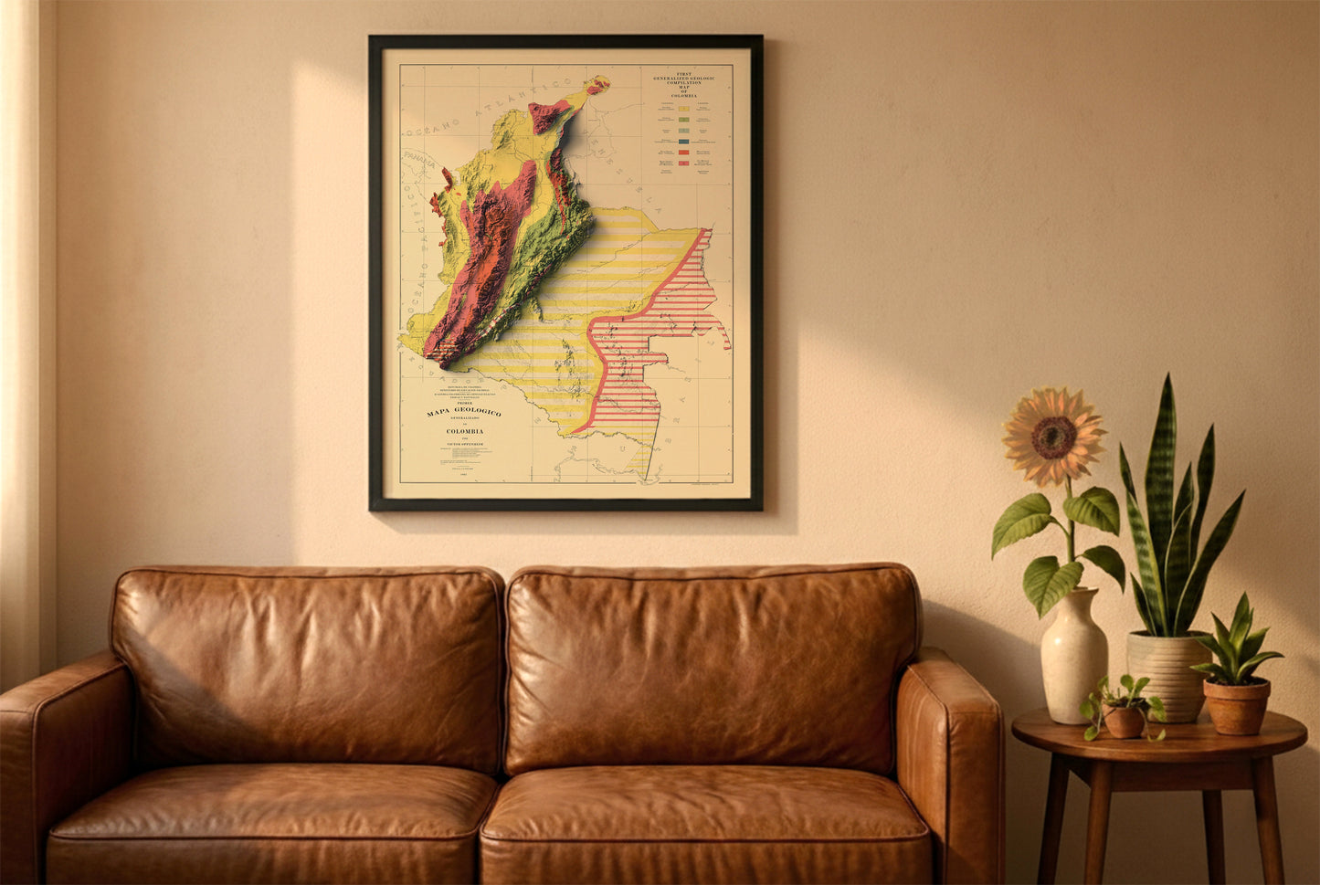 Colombia vintage relief map in a black frame above a brown leather sofa. Boho living room with warm sunlight, sunflower, and indoor plants on a wooden side table