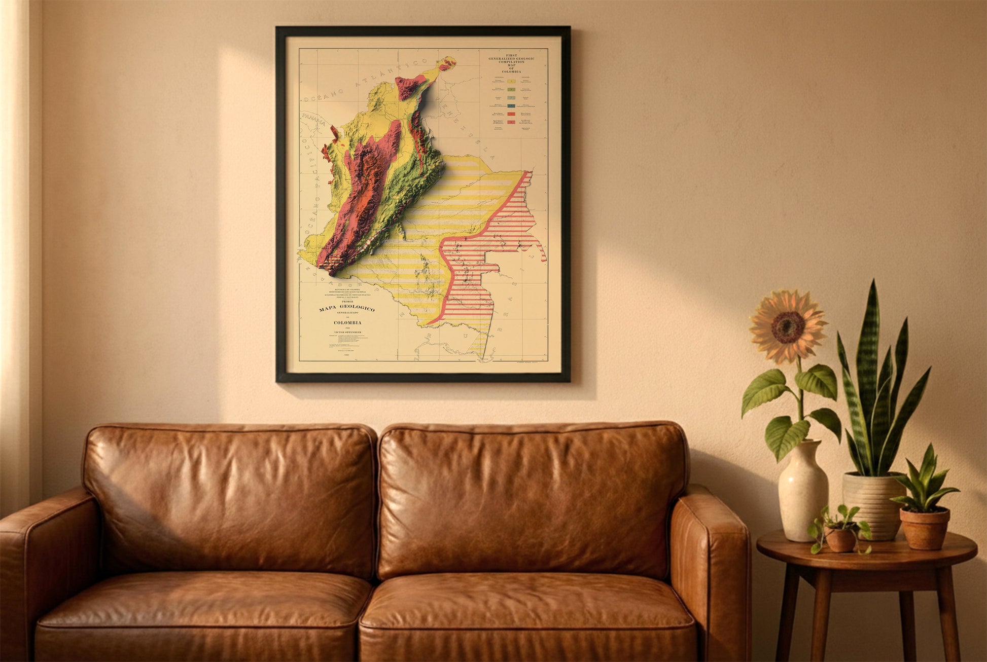 Colombia vintage relief map in a black frame above a brown leather sofa. Boho living room with warm sunlight, sunflower, and indoor plants on a wooden side table
