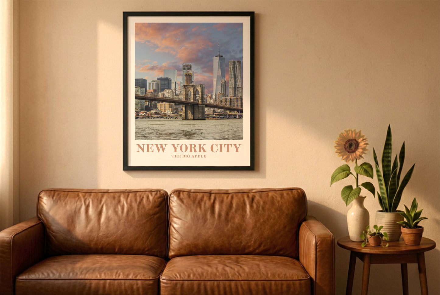 New York City poster in a black frame above a brown leather sofa. Boho living room with warm sunlight, sunflower, and indoor plants on a wooden side table